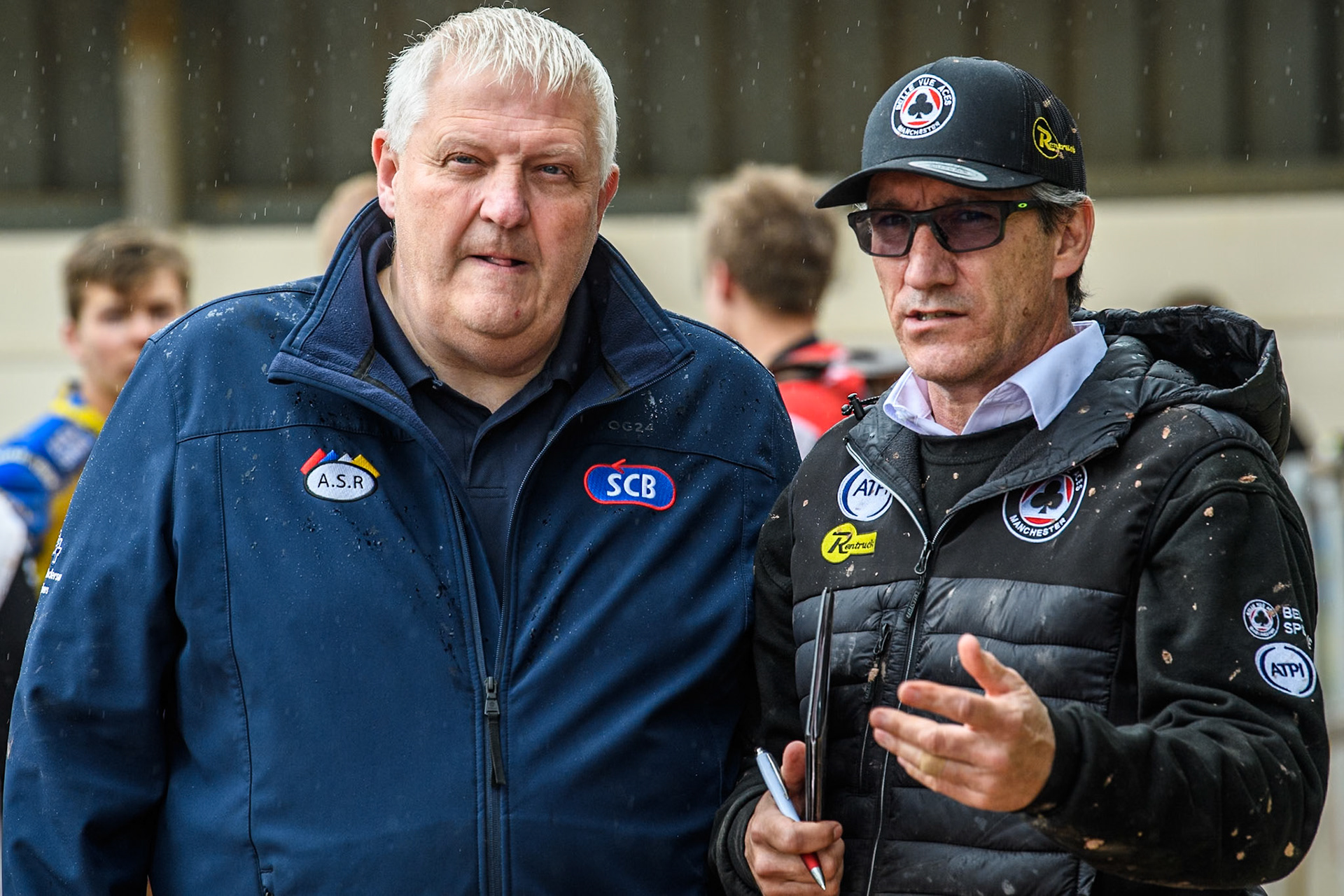 Referee Dave Watters (Left) listens to Belle Vue Aces' Team Manager Mark Lemon during the Rowe Motor Oil Premiership match between Belle Vue Aces and Sheffield Tigers at the National Speedway Stadium, Manchester on Monday 27th May 2024. (Photo: Ian Charles | MI News)