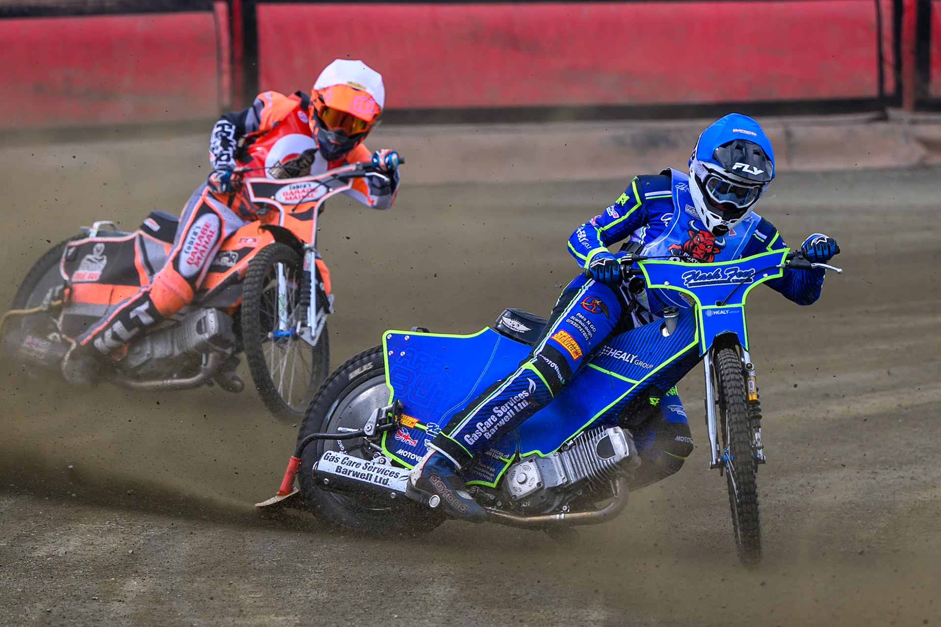 Arran Butcher of Buxton Bulls  in Blue leading Connor Coles of NDL Nomads   in White during the  Challenge match between Buxton Bulls and NDL Nomads at Hi-Edge Speedway, Buxton on Sunday 19th April 2026. (Photo: Ian Charles | MI News)
