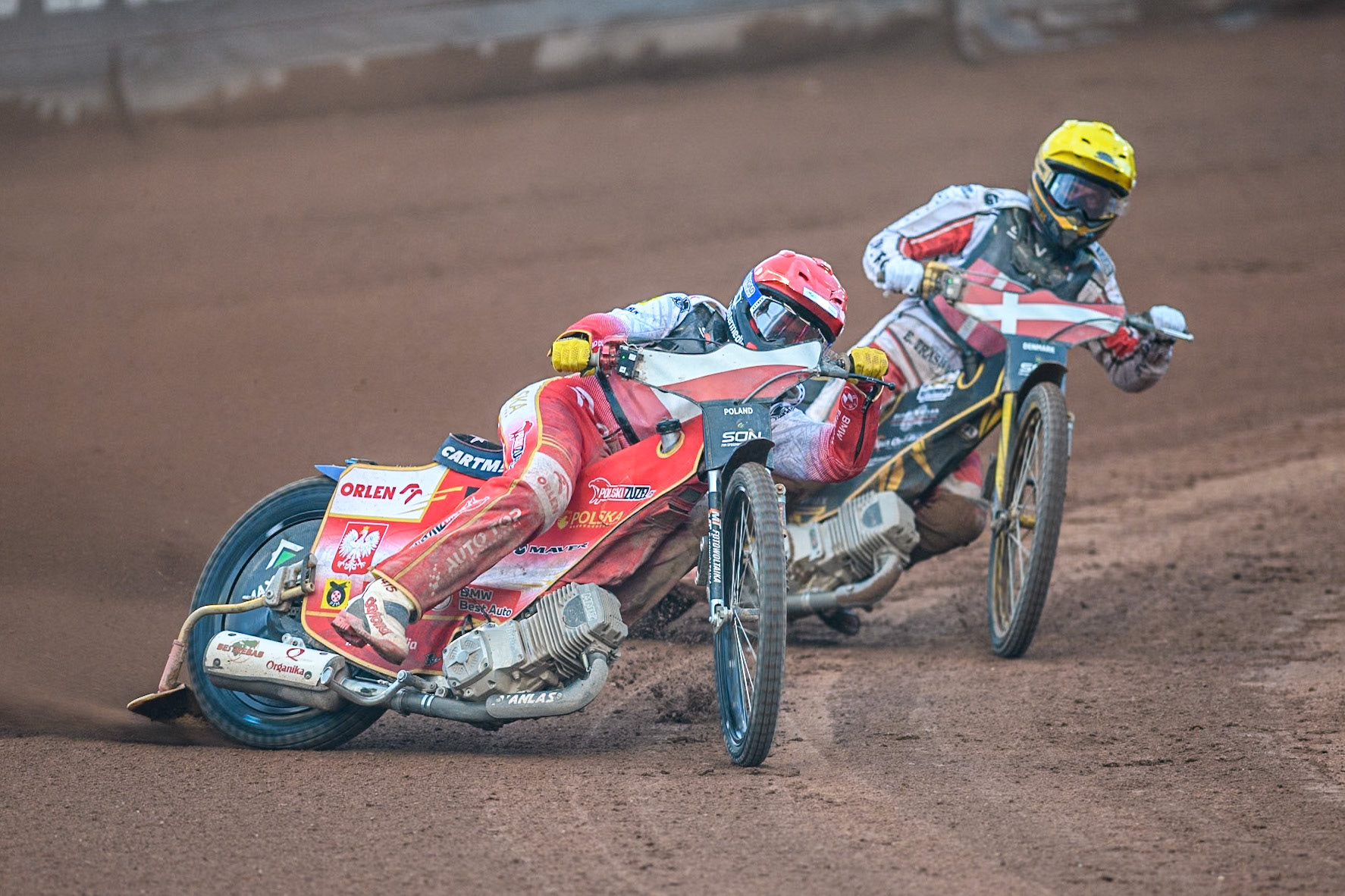 POLAND v DENMARK Dominik Kubera of Poland in Red leading Anders Thomsen of Denmark in Yellow during the Monster Energy FIM Speedway of Nation Final at the National Speedway Stadium, Manchester on Saturday 13th July 2024. (Photo: Ian Charles | MI News)