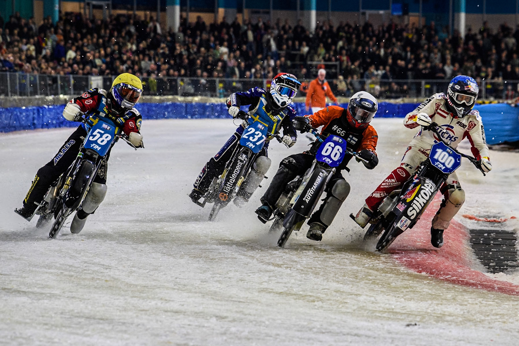 Austria's Franz Zorn (100) in Blue rides inside Finland's Aki Ala-Riihimäki (66) in White and Sweden's Stefan Svensson (58) in Yellow with Sweden's Jimmy Hörnell Lidfalk (237) in Red behind  during the FIM Ice Speedway Gladiators World Championship Final 3 at Ice Rink Thialf, Heerenveen on Saturday 6th April 2024. (Photo: Ian Charles | MI News)