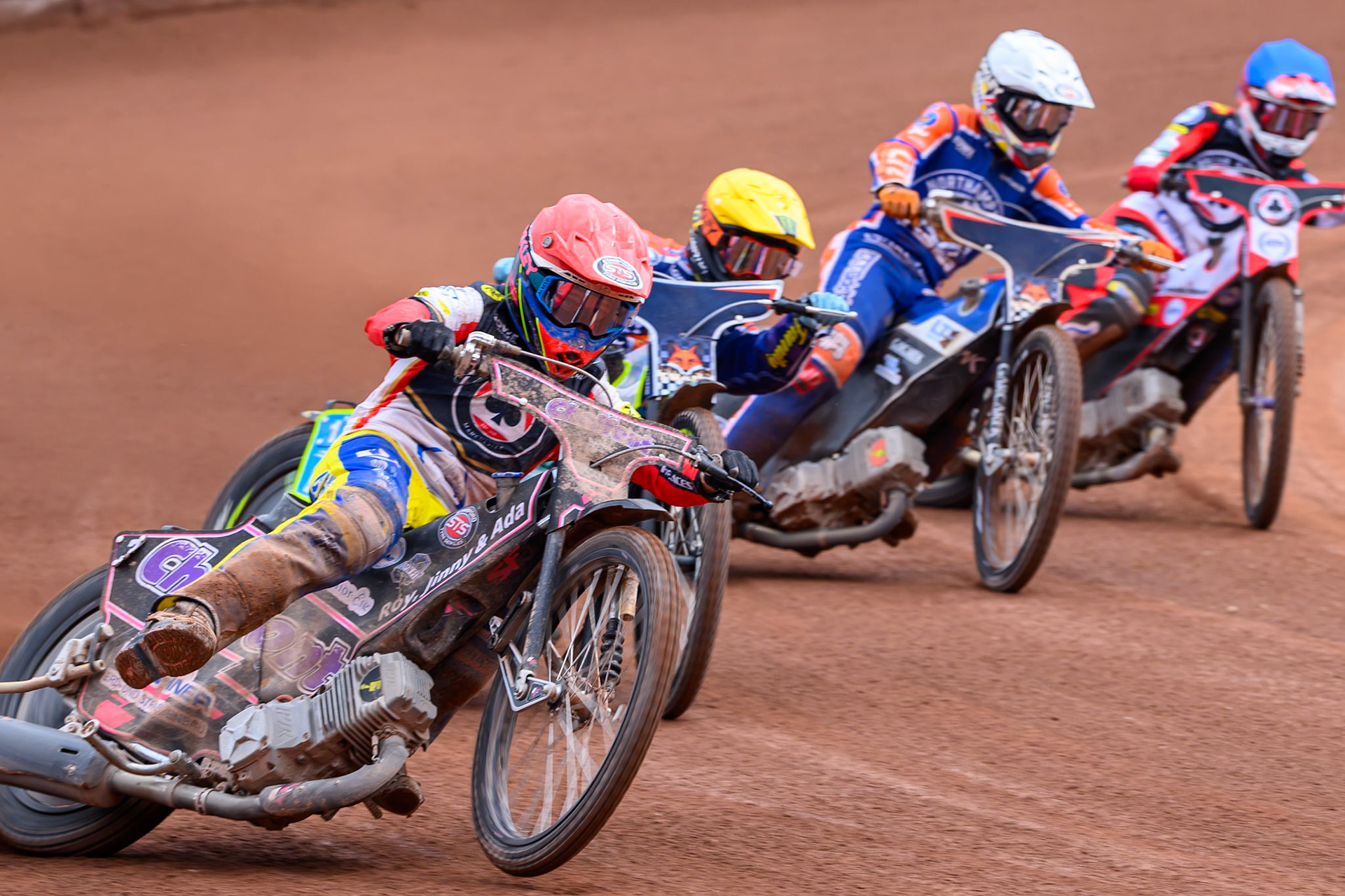Leon Flint, Guest Rider for Belle Vue Aces in Red leading Jaimon Lidsey of Northampton Foxes  in Yellow, Nicolai Klindt of Northampton Foxes in White and Zach Cook of Belle Vue Aces in Blue during the Rowe Motor Oil Premiership match between Belle Vue Aces and Northampton Foxes at the National Speedway Stadium, Manchester on Monday 4th May 2026. (Photo: Ian Charles | MI News)
