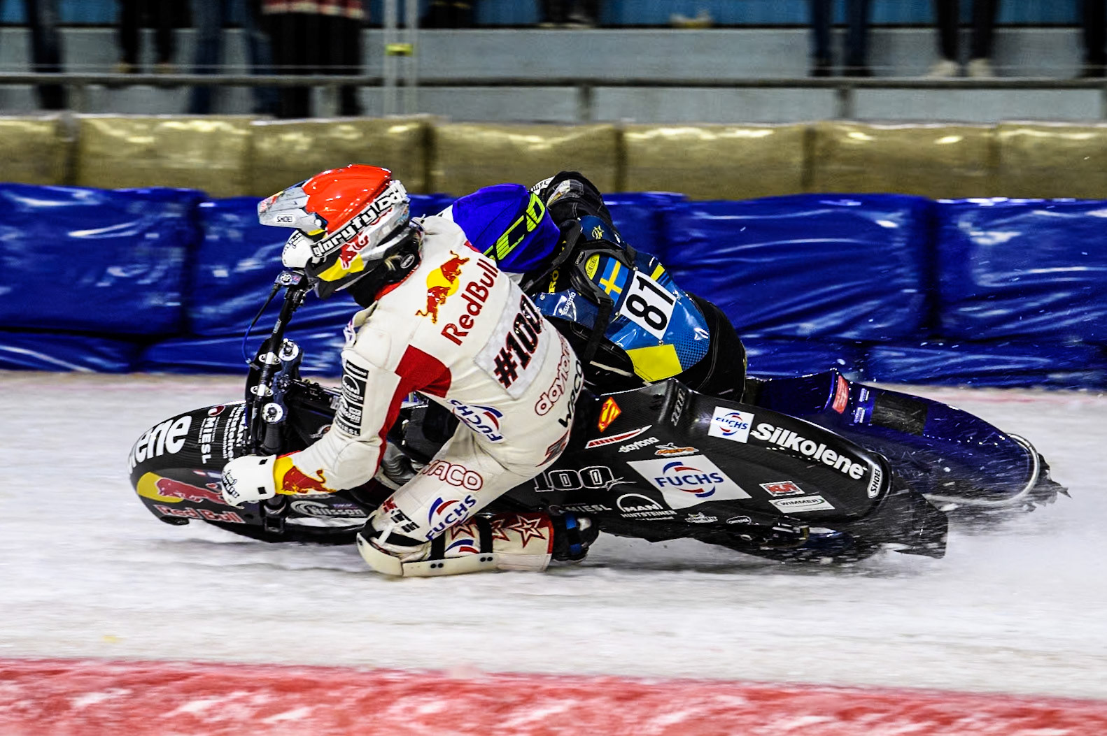 Austria's Franz Zorn (100) in Red rides inside Sweden"s Jimmy Olsén (81) in Blue during the FIM Ice Speedway Gladiators World Championship Final 4 at Ice Rink Thialf, Heerenveen on Sunday 7th April 2024. (Photo: Ian Charles | MI News)