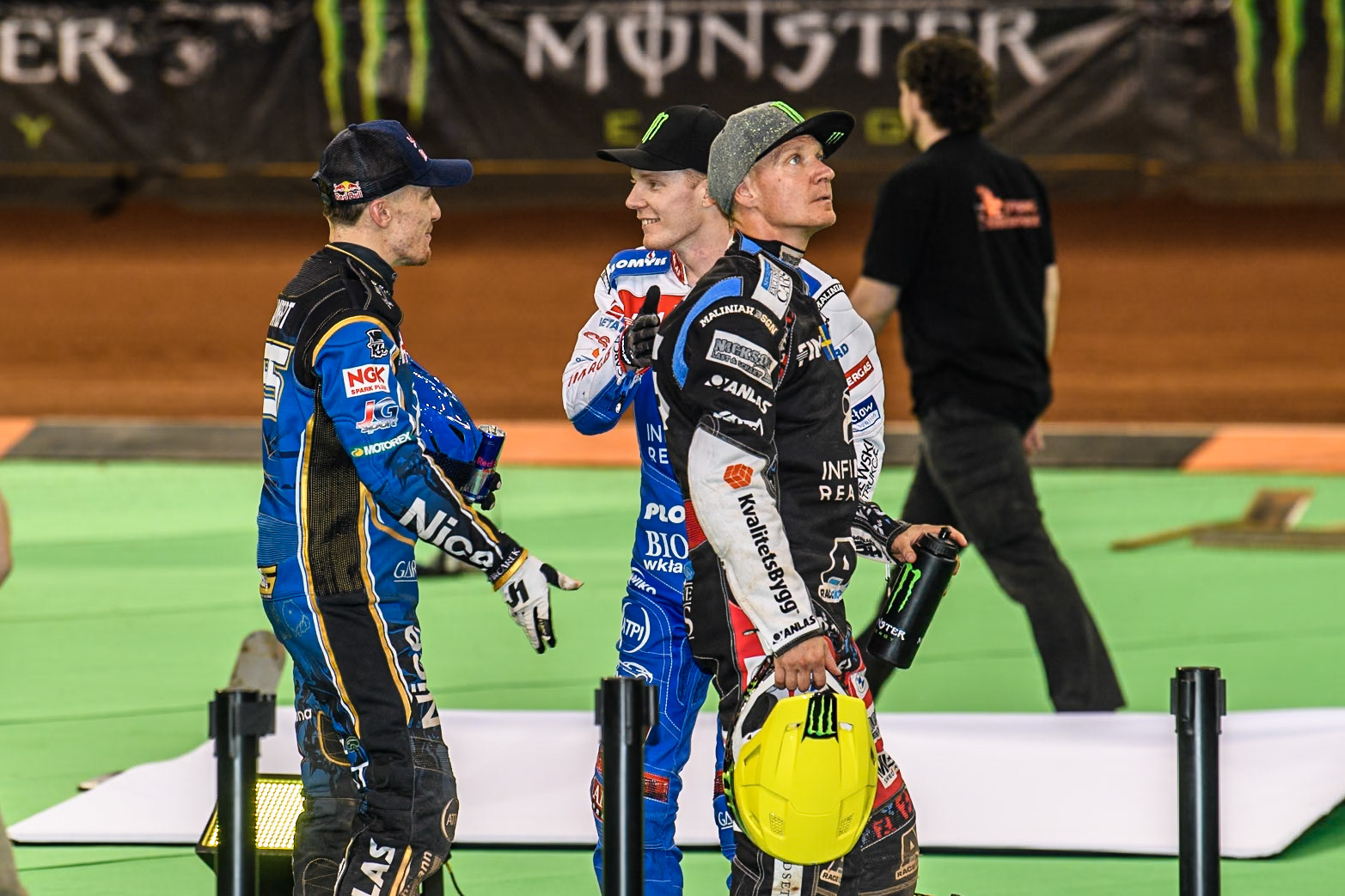 Robert Lambert (505) of Great Britain (Left) and Daniel Bewley (99) of Great Britain (centre) chat whilst Fredrik Lindgren (66) of Sweden (Right) waits to be called to the podium during the FIM Speedway Grand Prix of Great Britain at The Principality Stadium, Cardiff on Saturday 17th August 2024. (Photo: Ian Charles | MI News)
