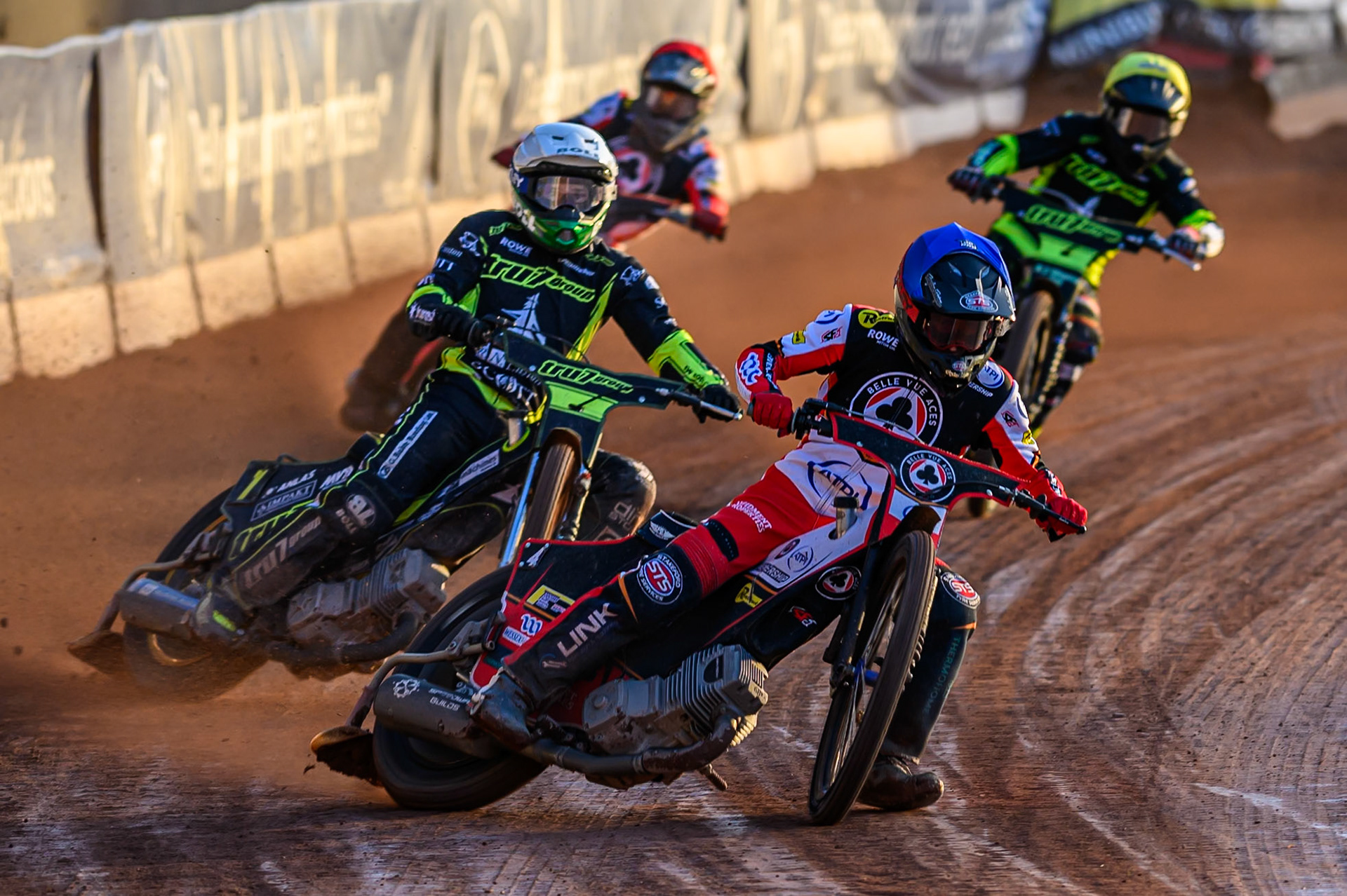 Zach Cook of Belle Vue Aces  in Blue leading Jason Doyle of Ipswich Witches  in White, Danny King of Ipswich Witches  in Yellow and Norick Blödorn of Belle Vue Aces  in Red during the Rowe Motor Oil Premiership match between Belle Vue Aces and Ipswich Witches at the National Speedway Stadium, Manchester on Monday 4th August 2025 (Photo: Ian Charles | MI News)