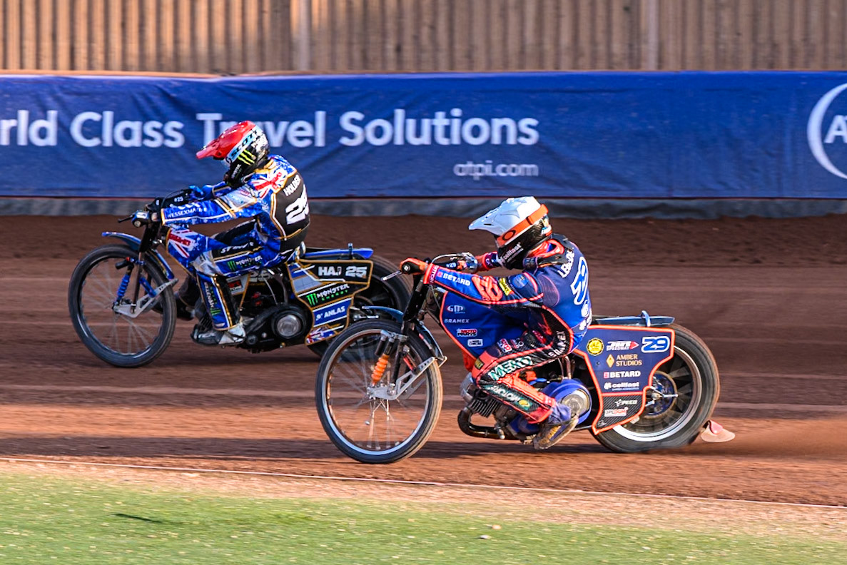 Andzejs Lebedevs (29) of Latvia in White chases Jack Holder (25) of Australia in Red during the ATPI FIM Speedway Grand Prix Round 5 at the National Speedway Stadium, Manchester, on Saturday 14th June 2025. (Photo: Ian Charles | MI News)