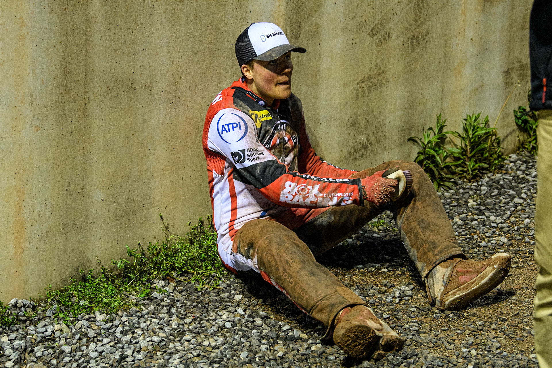 Belle Vue Aces' Norick Blödorn clears the wet shale off his kevlars during the Rowe Motor Oil Premiership match between Belle Vue Aces and Ipswich Witches at the National Speedway Stadium, Manchester on Monday 22nd April 2024. (Photo: Ian Charles | MI News)