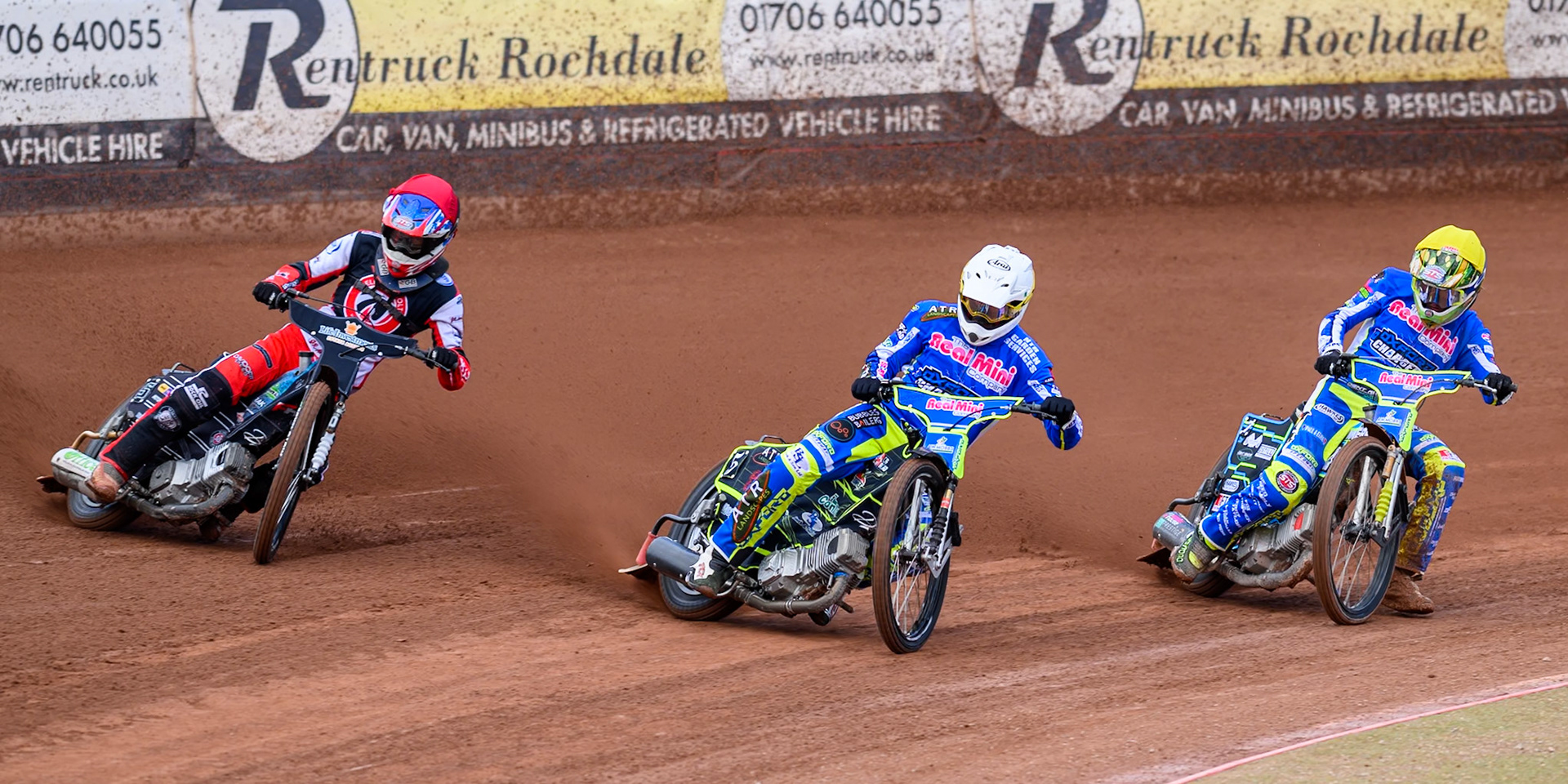 Belle Vue Colts' Freddy Hodder  in Red rides outside Oxford Chargers' Darryl Ritchings in White and Oxford Chargers' Senna Summers  in Yellow  during the WSRA National Development League match between Belle Vue Colts and Oxford Chargers at the National Speedway Stadium, Manchester on Sunday 1st June 2025. (Photo: Ian Charles | MI News)