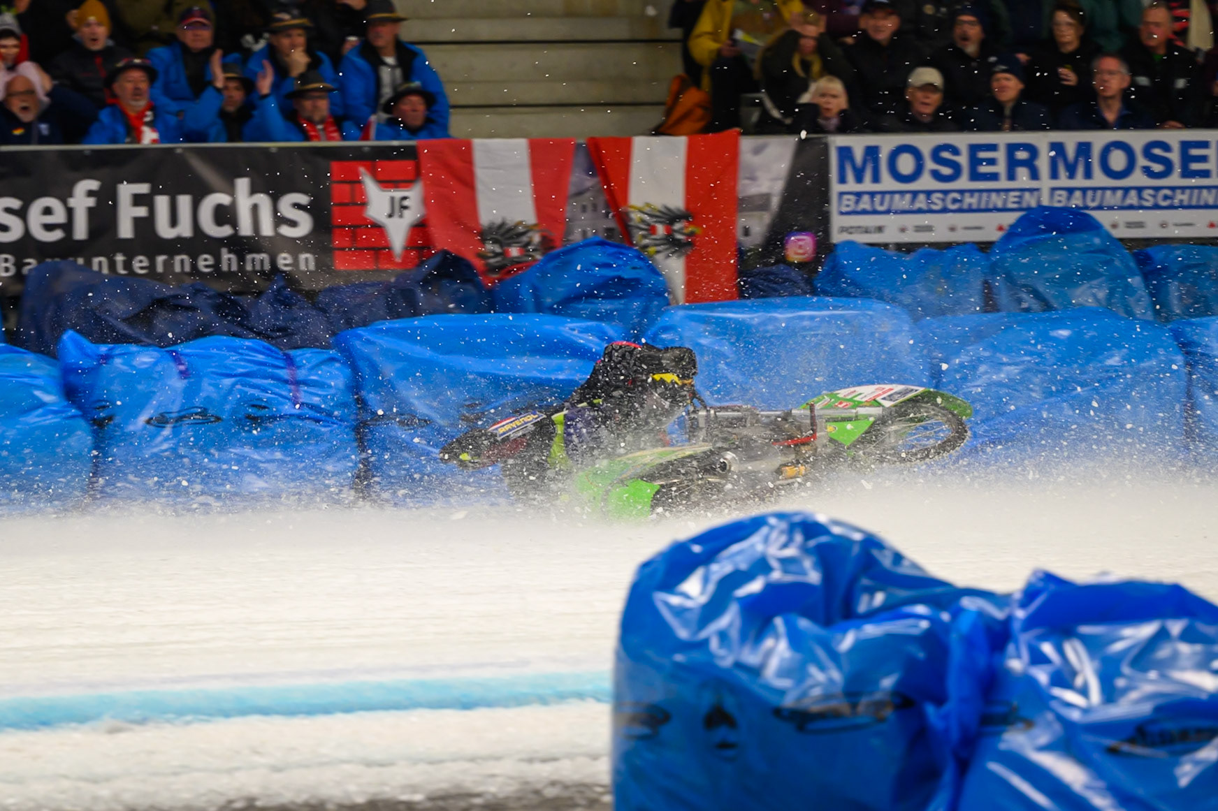 Johann Weber (33) of Germany  spins off behind Heikki Huusko (67) of Finland in Blue during the Ice Speedway Gladiators World Championship Final 1 at Max-Aicher-Arena, Inzell on Saturday 14th March 2026. (Photo: Ian Charles | MI News)