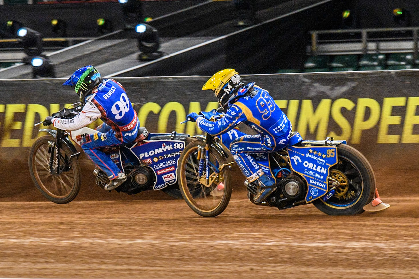 Daniel Bewley (99) of Great Britain in Blue leading Bartosz Zmarzlik (95) of Poland  in Yellow during the FIM Speedway Grand Prix of Great Britain at The Principality Stadium, Cardiff on Saturday 17th August 2024. (Photo: Ian Charles | MI News)