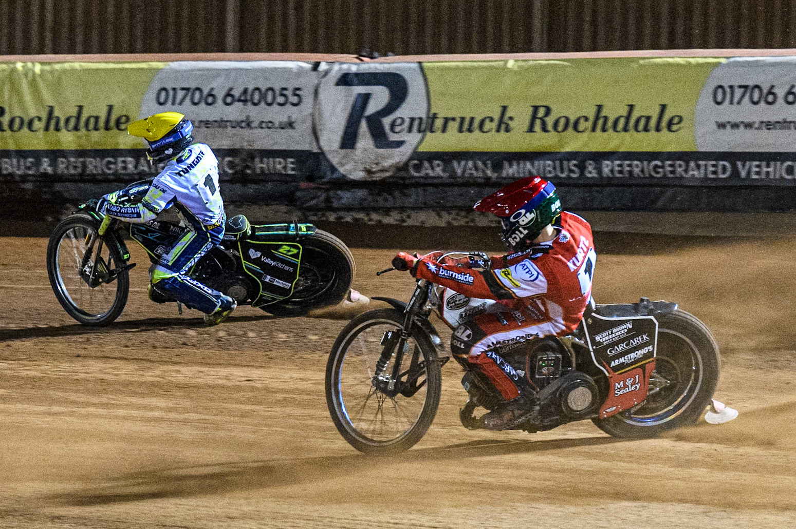 Belle Vue Aces' Brady Kurtz in Red rides inside Oxford Spires' Rohan Tungate in White during the Rowe Motor Oil Premiership match between Belle Vue Aces and Oxford Spires at the National Speedway Stadium, Manchester on Monday 14th April 2025. (Photo: Ian Charles | MI News)
