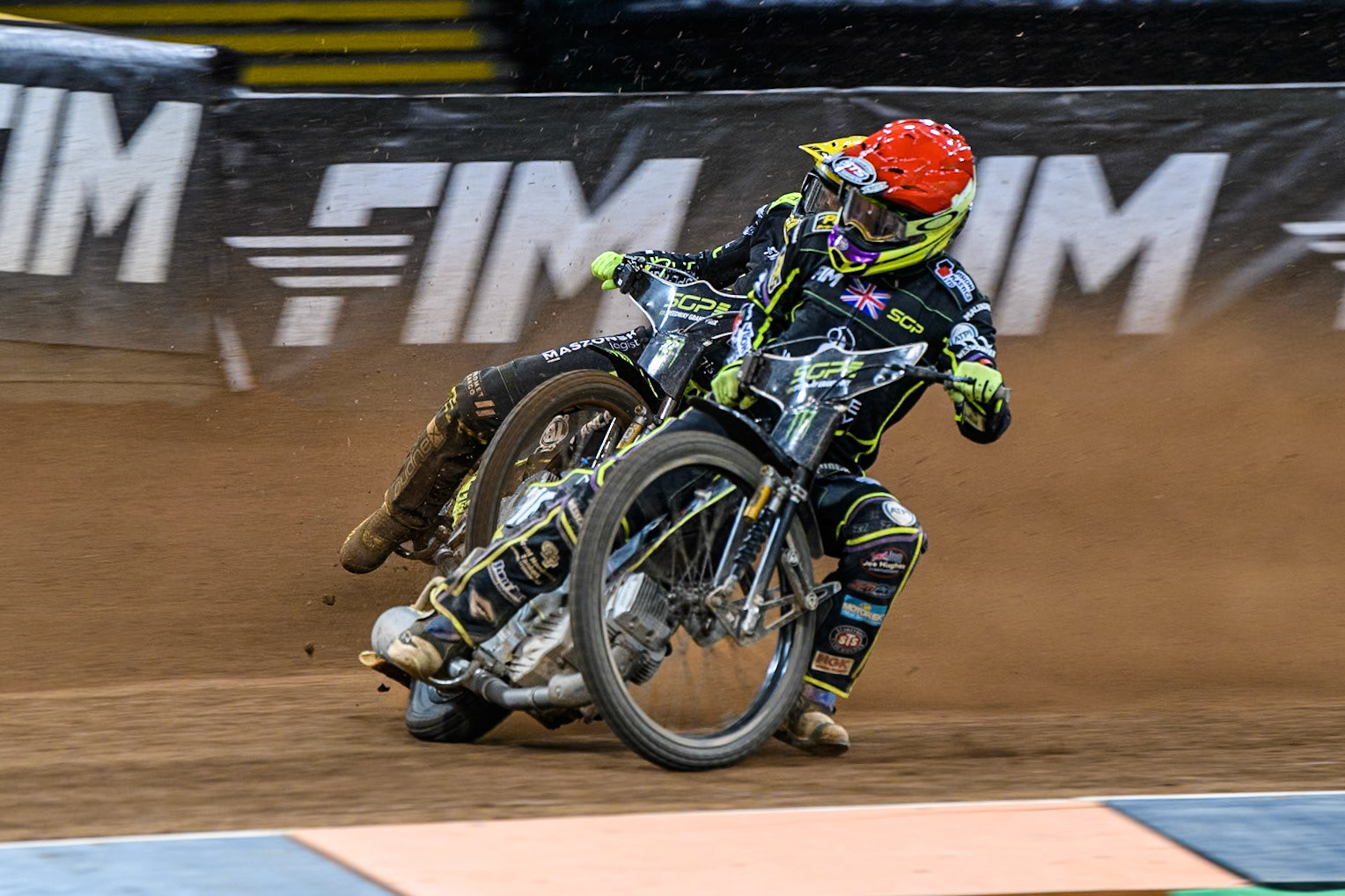 Tom Brennan (16) Wild card rider of Great Britain in Red leading Martin Vaculik (54) of Slovakia in Yellow during the FIM Speedway Grand Prix of Great Britain at The Principality Stadium, Cardiff on Saturday 17th August 2024. (Photo: Ian Charles | MI News)