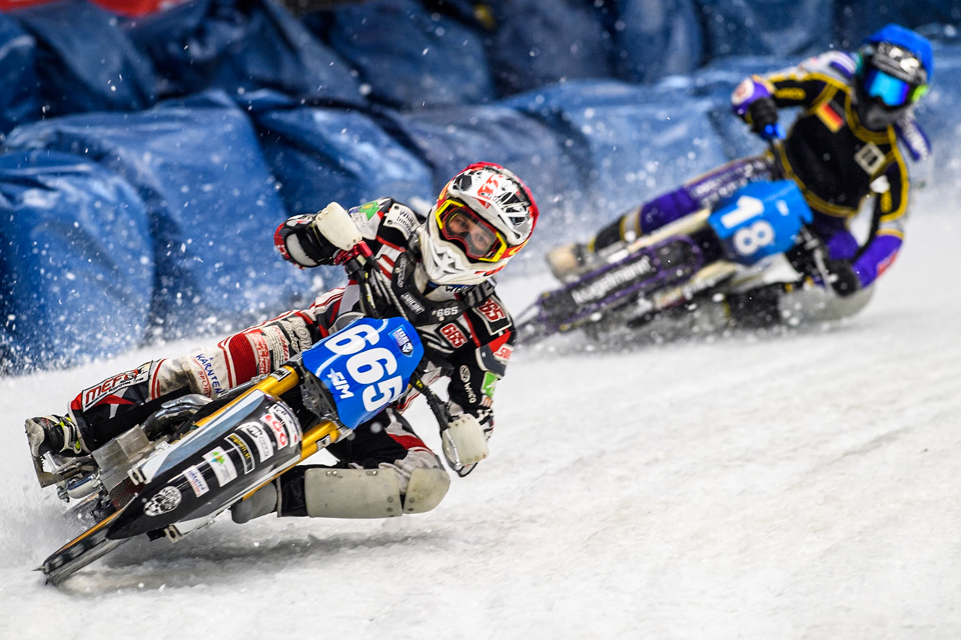 Austria's Charly Ebner (665) (Red) leads  Germany's Christoph Kirchner (18) (Blue) during the FIM Ice Speedway Gladiators World Championship Final 2 at the Max-Aicher-Arena, Inzell on Sunday 24 March 2024. (Photo: Ian Charles | MI News)