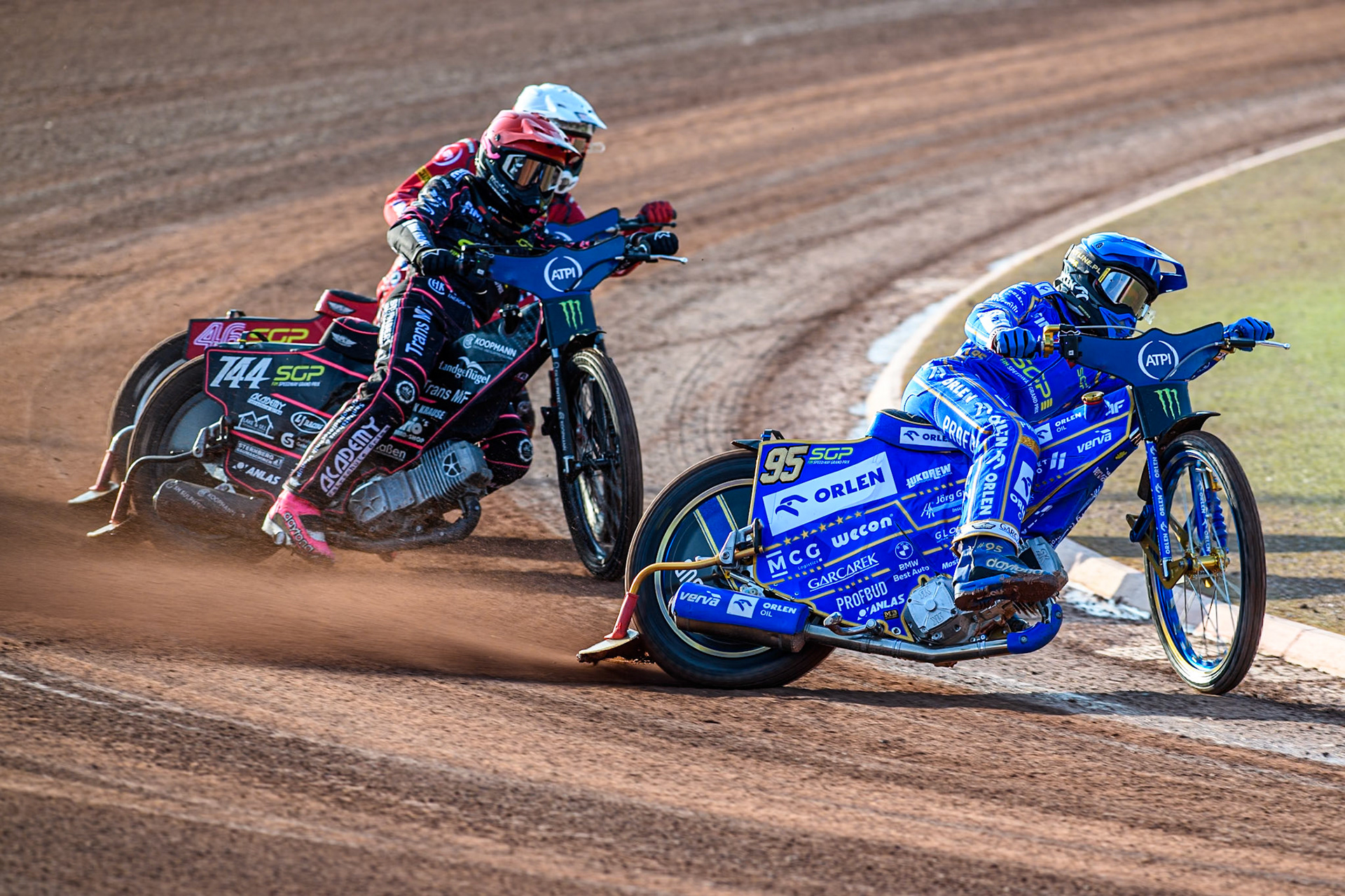 Bartosz Zmarzlik (95) of Poland in Blue leading Kai Huckenbeck (744) of Germany in Red and Max Fricke (46) of Australia in White during the ATPI FIM Speedway Grand Prix Round 5 at the National Speedway Stadium, Manchester, on Saturday 14th June 2025. (Photo: Ian Charles | MI News)