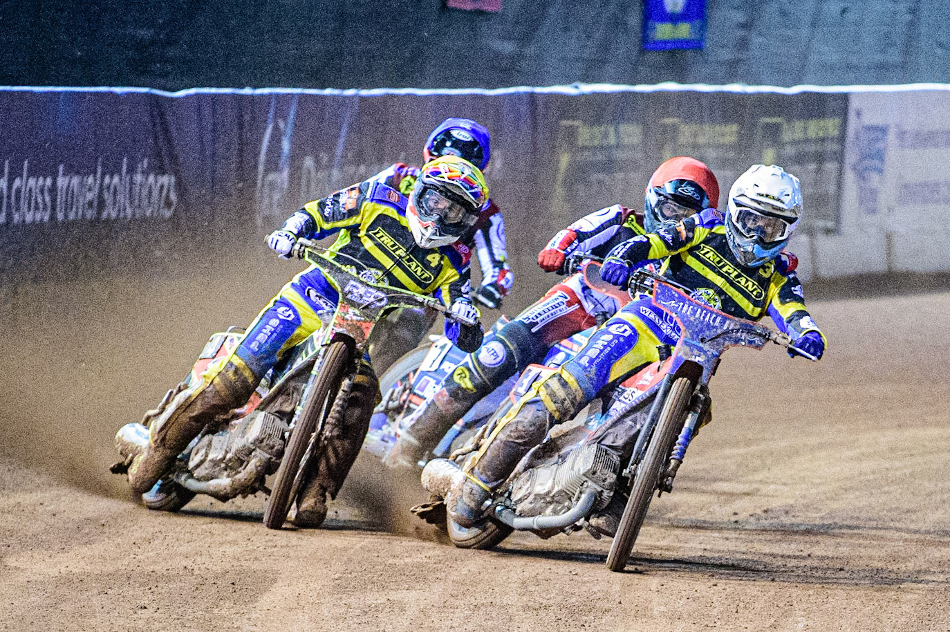 David Bellego (Yellow) and Adam Ellis  (White) lead Brady Kurtz  (Red) and Tom Brennan  (Blue) during the SGB Premiership match between Belle Vue Aces and Sheffield Tigers at the National Speedway Stadium, Manchester on Monday 27th March 2023. (Photo: Ian Charles | MI News)