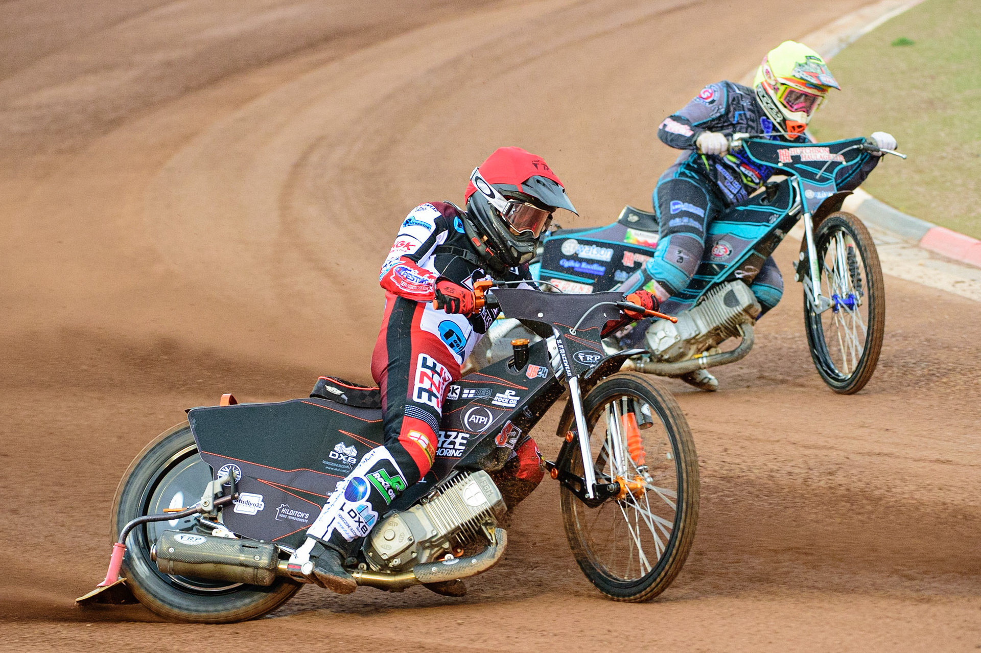 MANCHESTER, UK. JUN 24TH Jack Smith (Red) outside Mason Watson  Yellow)  during the National Development League match between Belle Vue Colts and Berwick Bullets at the National Speedway Stadium, Manchester on Friday 24th June 2022. (Credit: Ian Charles | MI News)