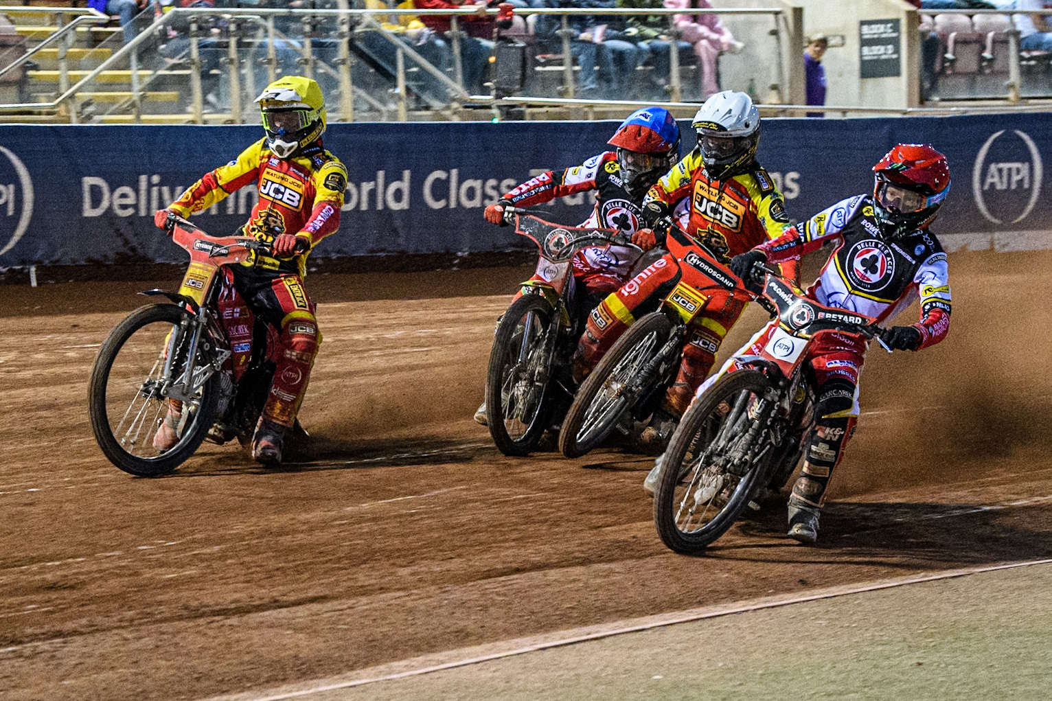 Belle Vue Aces' Dan Bewley in Red rides inside Leicester Lions' Max Fricke in Yellow as Belle Vue Aces' Tate Zischke in Blue and Leicester Lions' Kyle Howarth in White collide during the Rowe Motor Oil Premiership match between Belle Vue Aces and Leicester Lions at the National Speedway Stadium, Manchester on Monday 19th May 2025. (Photo: Ian Charles | MI News)