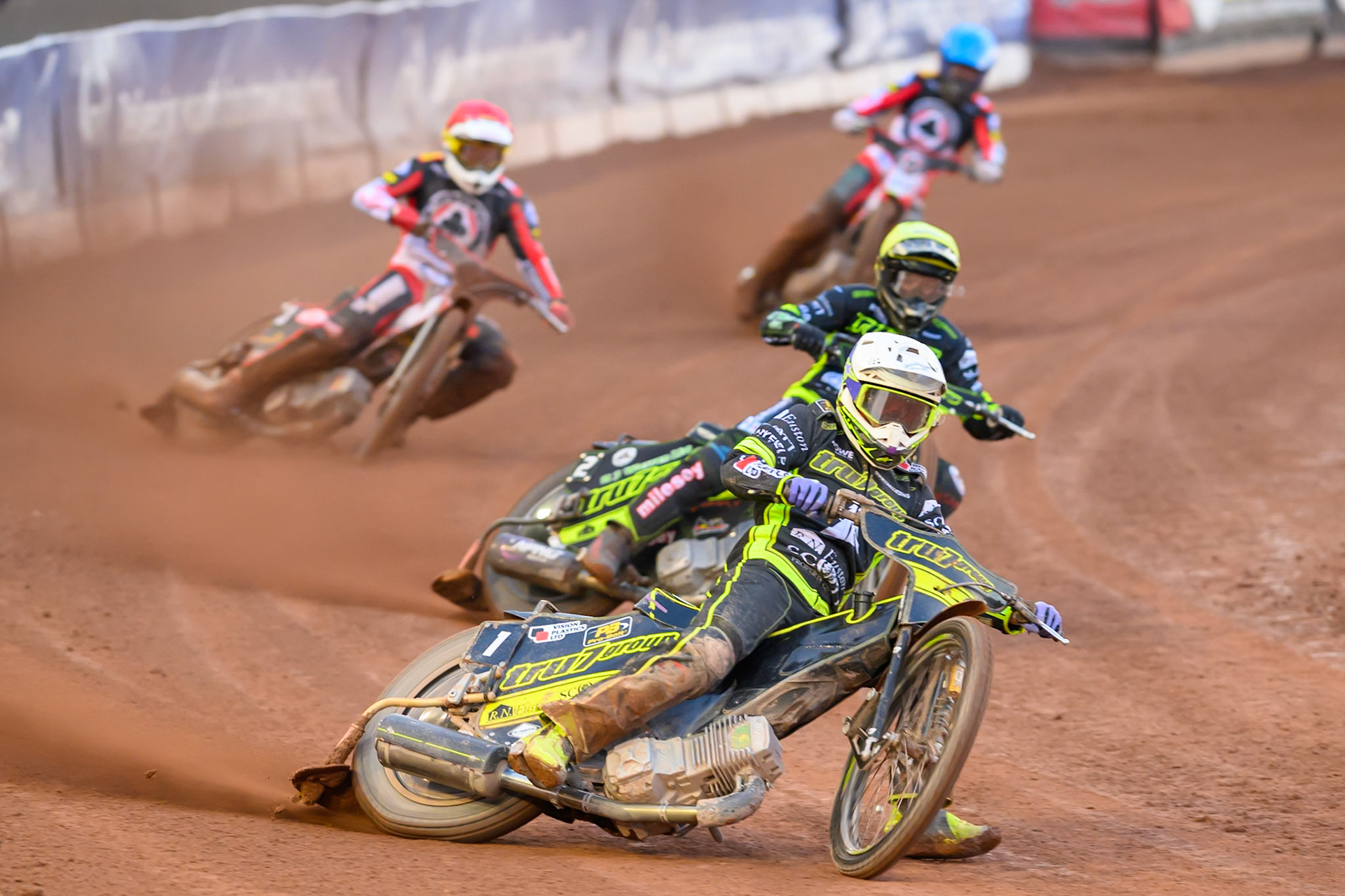 Tom Brennan of Ipswich Witches  in White leading Danny King of Ipswich Witches  in Yellow, Peter Kildemand of Belle Vue Aces  in Red and Zach Cook of Belle Vue Aces  in Blue during the Rowe Motor Oil Premiership match between Belle Vue Aces and Ipswich Witches at the National Speedway Stadium, Manchester on Monday 20th April 2026. (Photo: Ian Charles | MI News)
