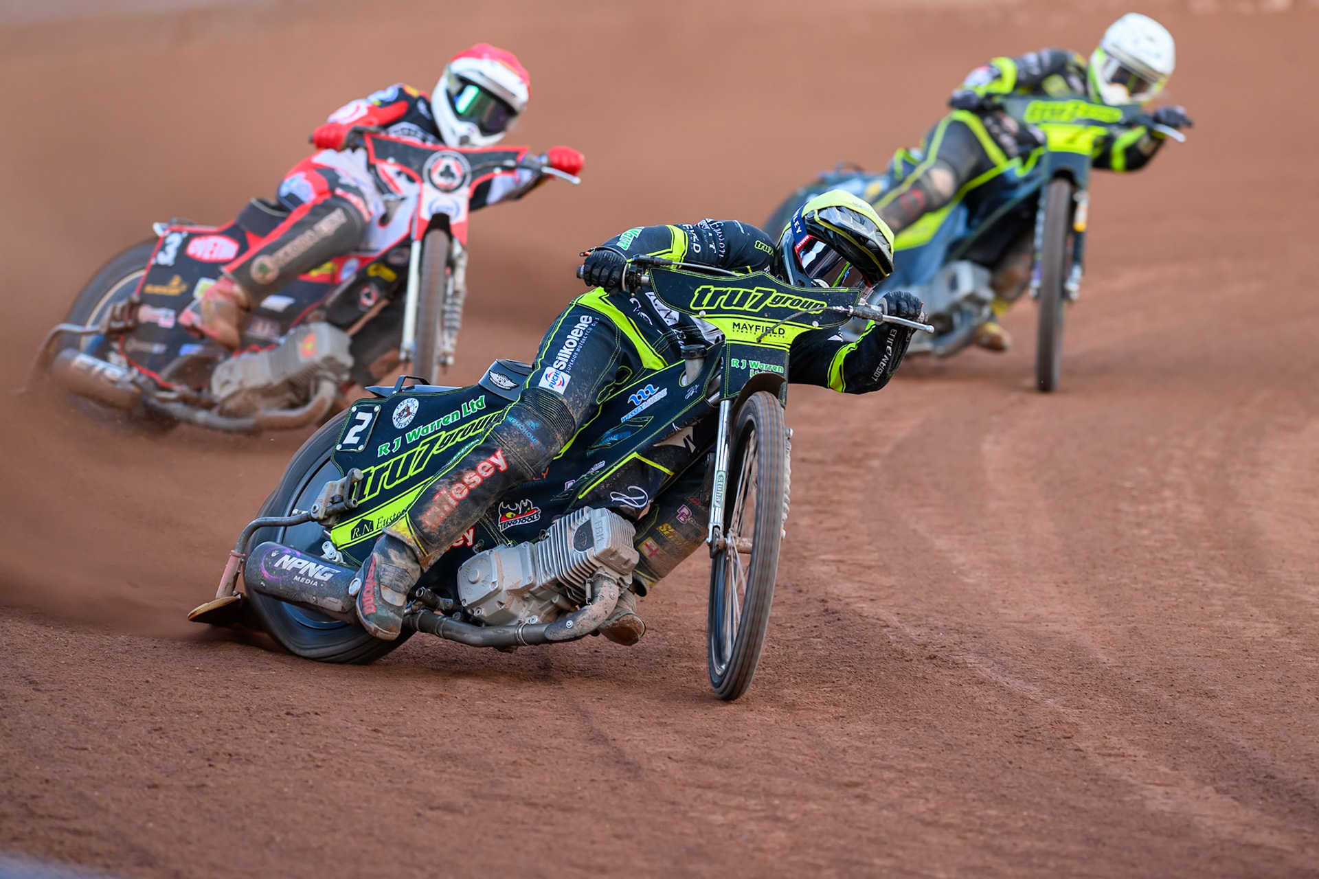 Danny King of Ipswich Witches in Yellow leading Peter Kildemand of Belle Vue Aces in Red and Tom Brennan of Ipswich Witches in White during the Rowe Motor Oil Premiership match between Belle Vue Aces and Ipswich Witches at the National Speedway Stadium, Manchester on Saturday 20th June 2026. (Photo: Ian Charles | MI News)