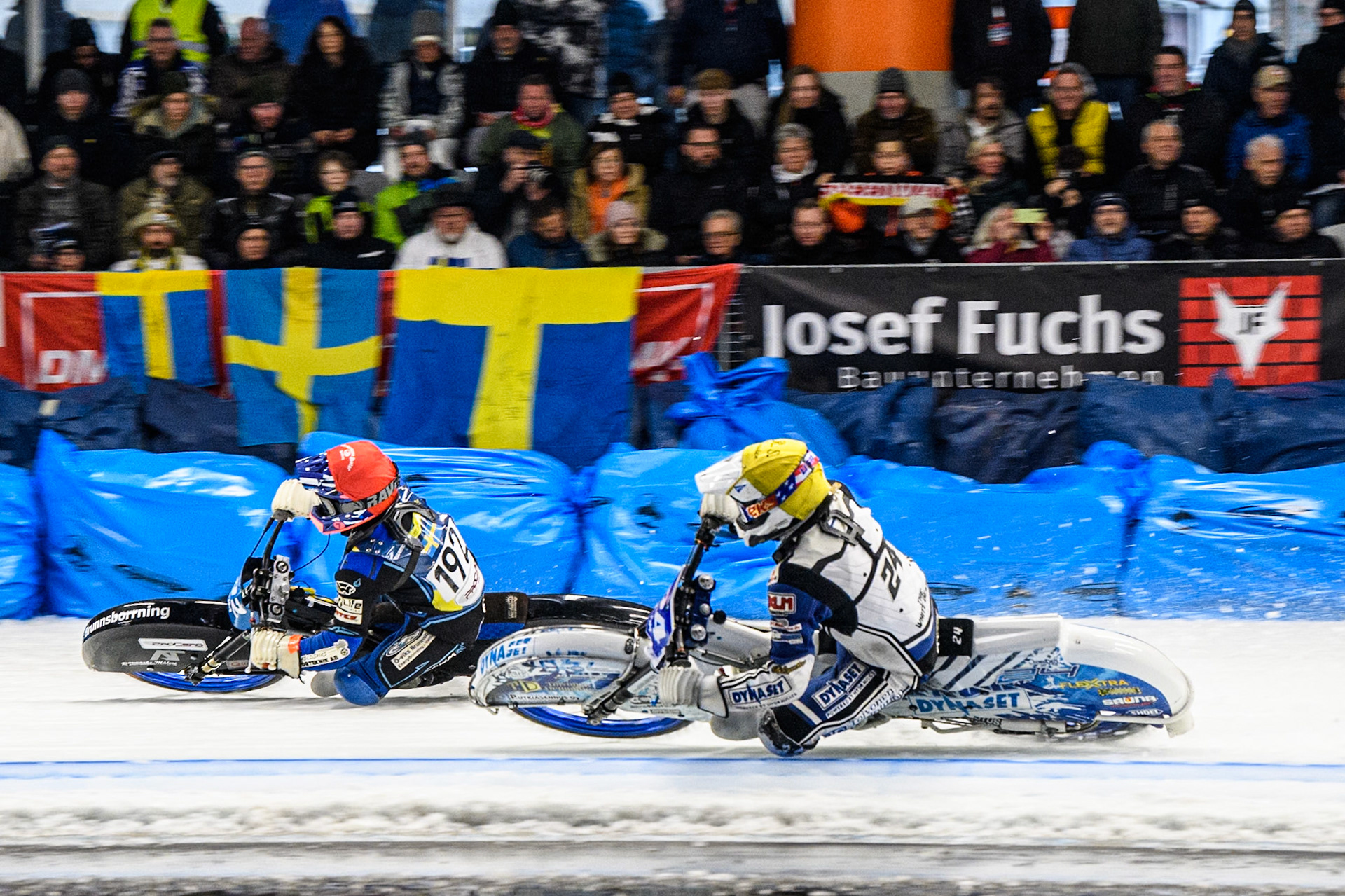 Max Koivula (24) of Finland in Yellow rides inside Niclas Svensson (192) of Sweden in Red during the Ice Speedway Gladiators World Championship Final 2 at Max-Aicher-Arena, Inzell on Sunday 16th March 2025. (Photo: Ian Charles | MI News)