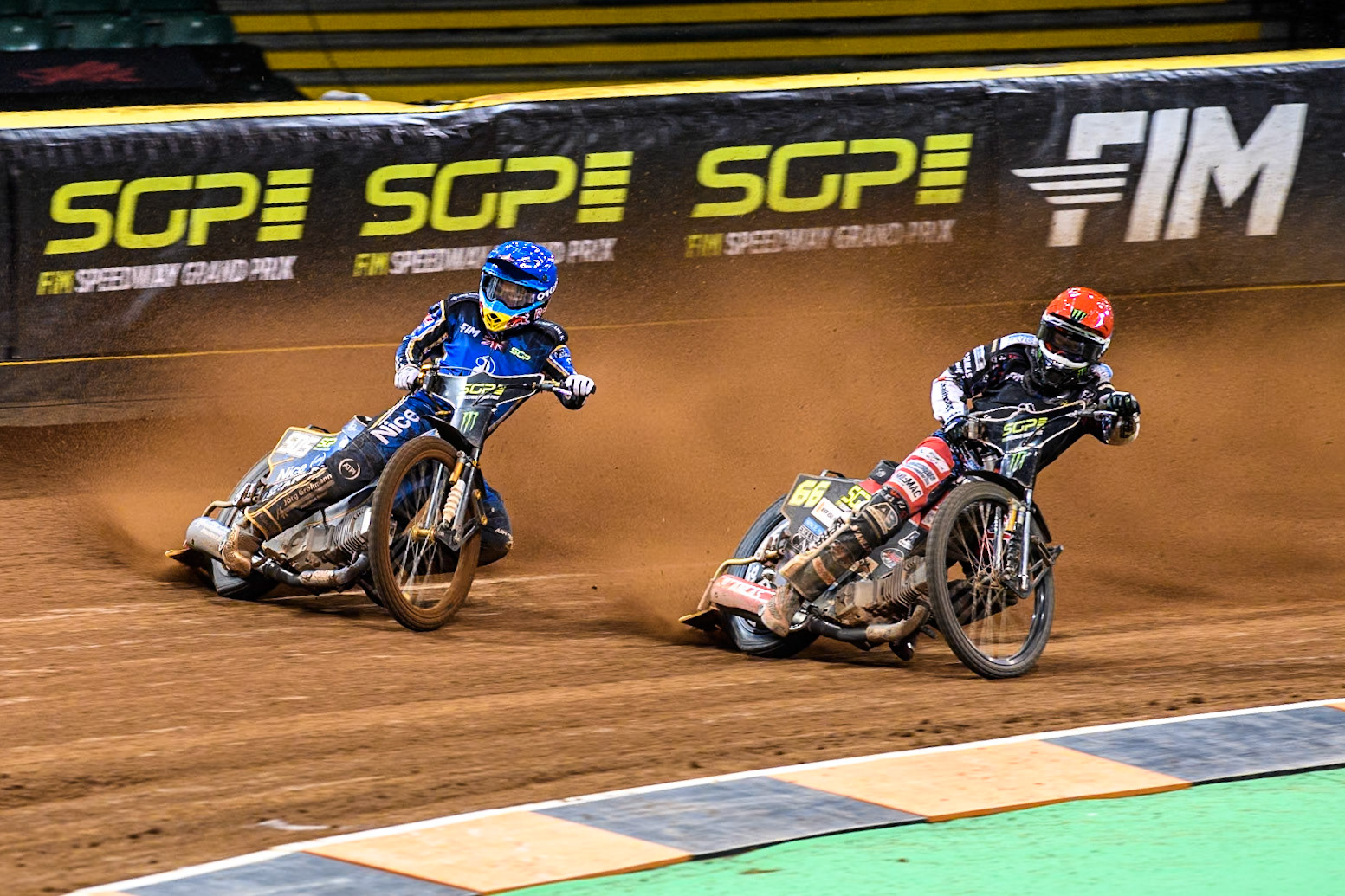 Robert Lambert (505) of Great Britain in Blue rides outside Fredrik Lindgren (66) of Sweden in Red in Semi Final 1 during the FIM Speedway Grand Prix of Great Britain at The Principality Stadium, Cardiff on Saturday 17th August 2024. (Photo: Ian Charles | MI News)