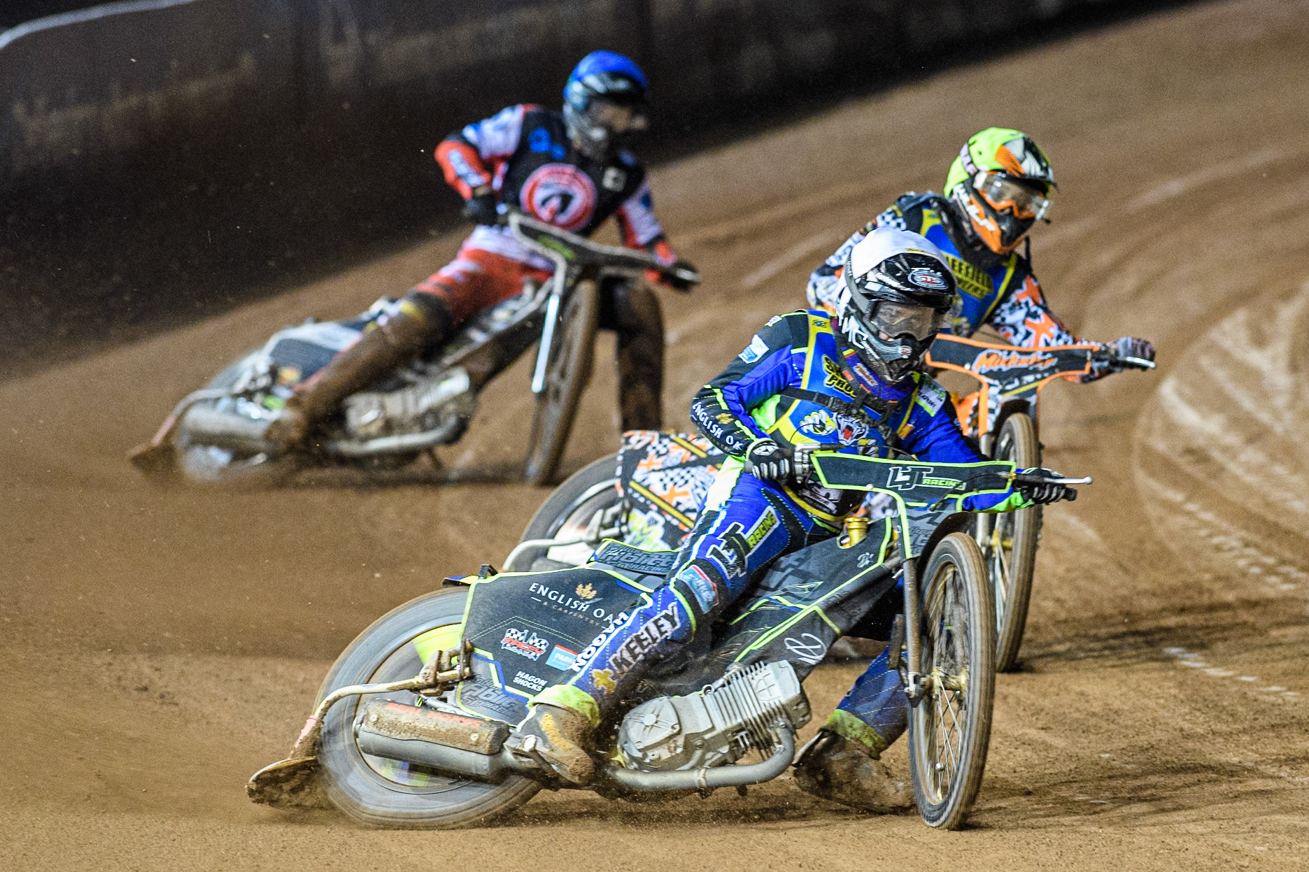 Sheffield Cubs' Nathan Ablitt in White leading Sheffield Cubs' Mickie Simpson in Yellow and Belle Vue Colts' Matt Marson in Blue during the WSRA National Development League match between Belle Vue Colts and Sheffield Tiger Cubs at the National Speedway Stadium, Manchester on Monday 7th October 2024. (Photo: Ian Charles | MI News)