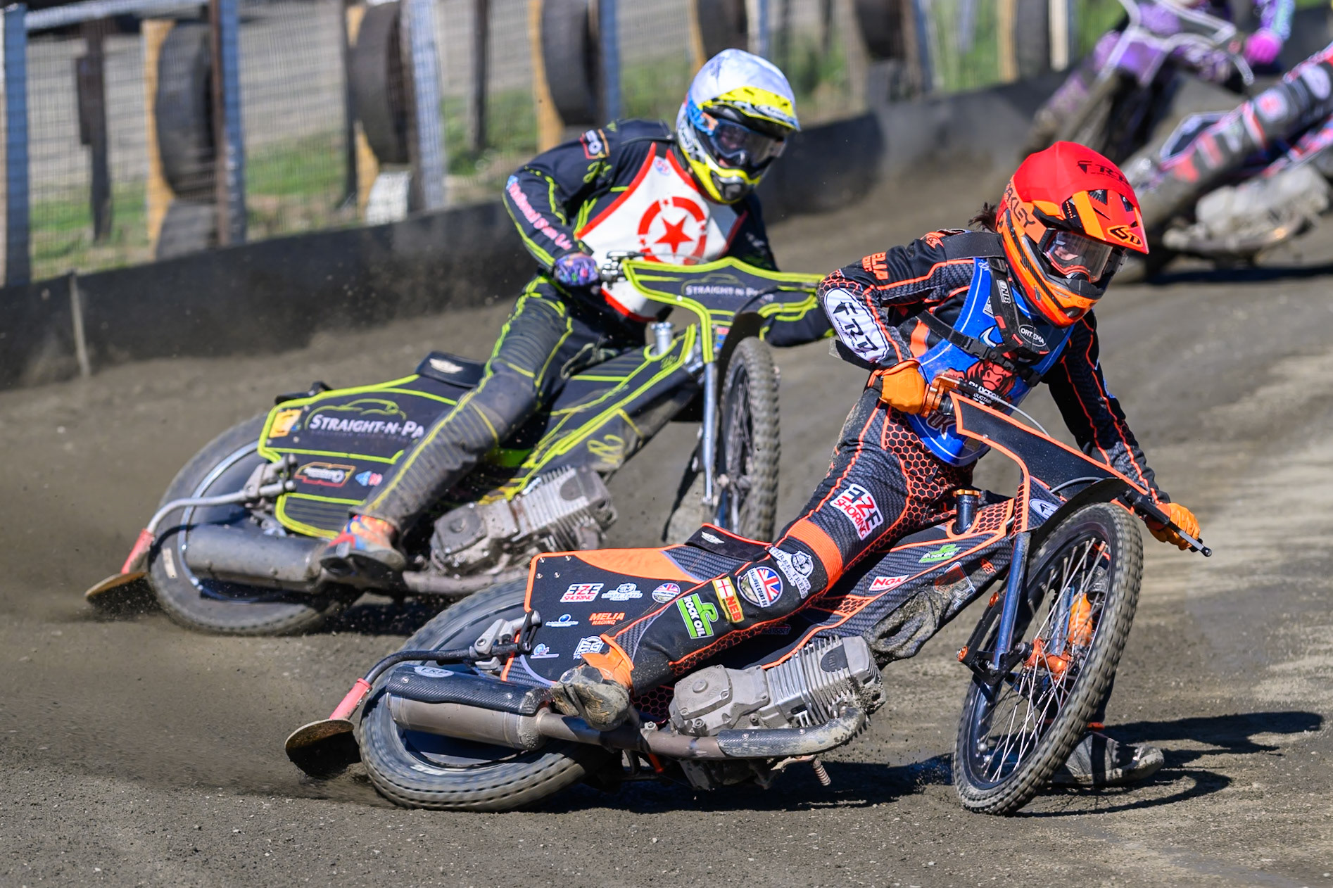 Jack Smith of Buxton Bulls  in Red leading Ben Whalley of Stoke Potters  in White during the National Development League Challenge match between Buxton Bulls and Stoke Potters at Hi-Edge Speedway, Buxton on Sunday 24th May 2026. (Photo: Ian Charles | MI News)