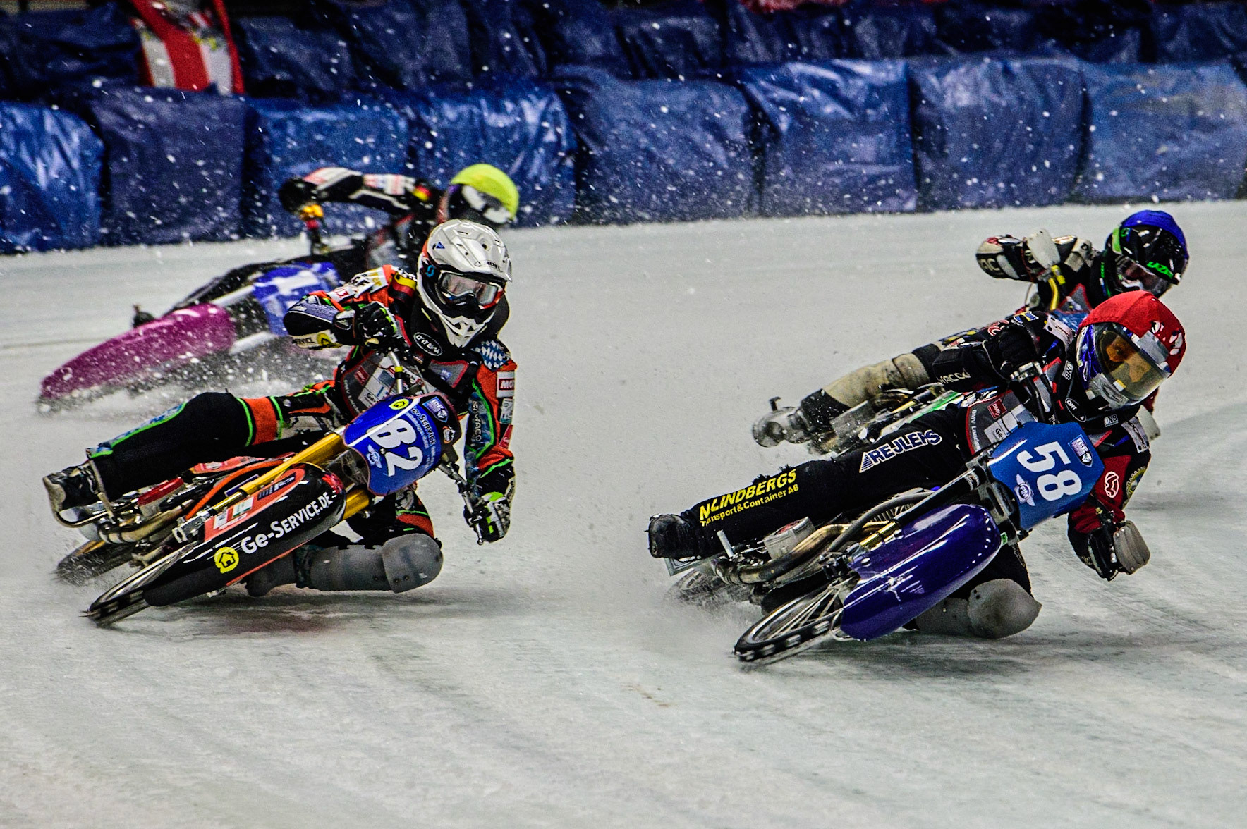 Stefan Svensson (58) (Red) inside Markus Jell (82) (White) with Harald Simon (50) (Blue) and Lukas Hutla (212) behind during the Ice Speedway Gladiators World Championship Final 1 at Max-Aicher-Arena, Inzell, Germany on Saturday 18th March 2023. (Photo: Ian Charles | MI News)