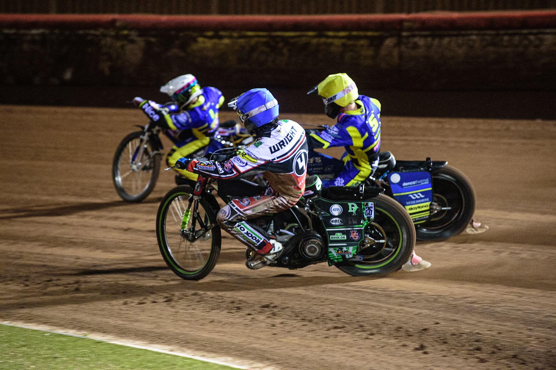 MANCHESTER, UK. OCT 7TH  Charles Wright  (Blue) inside Adam Ellis  (Yellow) and Jack Holder  (White) during the SGB Premiership Play off Semi-Final Second Leg between Belle Vue Aces and Sheffield Tigers at the National Speedway Stadium, Manchester on Thursday 7th October 2021. (Credit: Ian Charles | MI News)