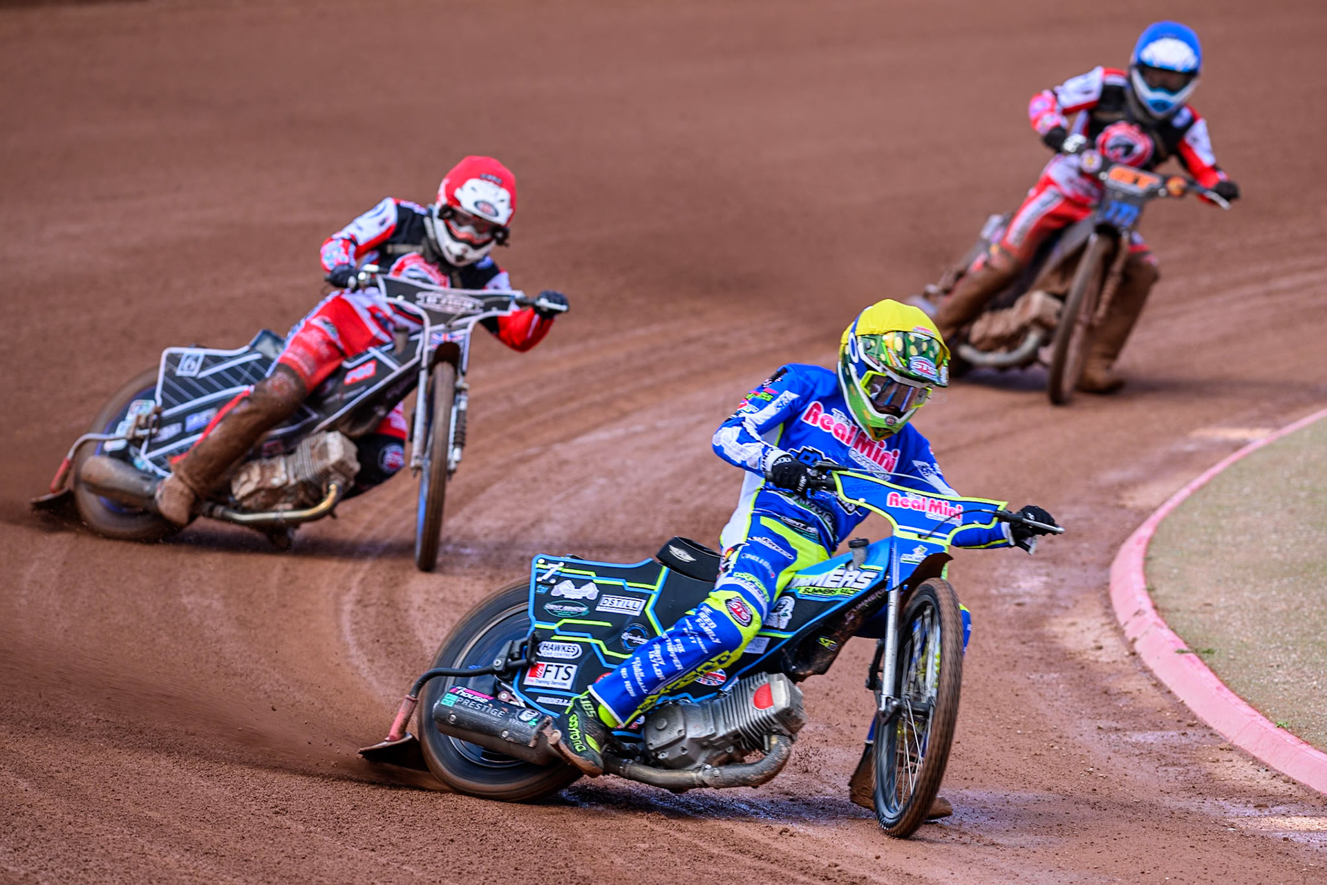 Oxford Chargers' Senna Summers  in Yellow leading Belle Vue Colts' Jack Shimelt  in Red and Belle Vue Colts' Billy Budd  in Blue during the WSRA National Development League match between Belle Vue Colts and Oxford Chargers at the National Speedway Stadium, Manchester on Sunday 1st June 2025. (Photo: Ian Charles | MI News)