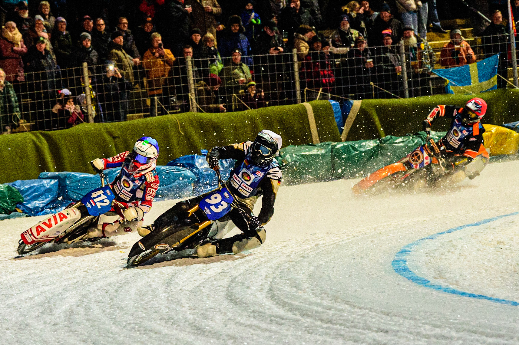 Franz Mayerbüchler (White) passes Niek Schaap (Blue) with Sebastian Reitsma (Red) behind during the German Individual Ice Speedway Championship at Horst-Dohm-Eisstadion, Berlin on Friday 3rd March 2023. (Photo: Ian Charles | MI News)
