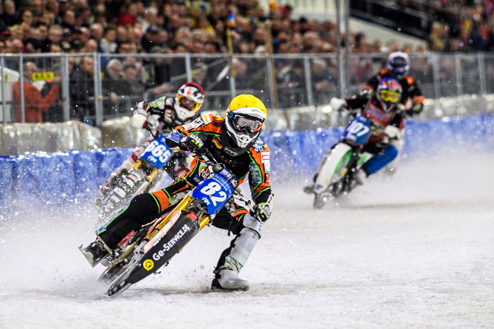 Germany's Markus Jell (82) \in Yellow leading Austria's Charly Ebner (665) in Red, Czech Republic's Andrej Diviš (107) in Blue and Netherland's Sebastian Reitsma (283) in White during the FIM Ice Speedway Gladiators World Championship Final 4 at Ice Rink Thialf, Heerenveen on Sunday 7th April 2024. (Photo: Ian Charles | MI News)