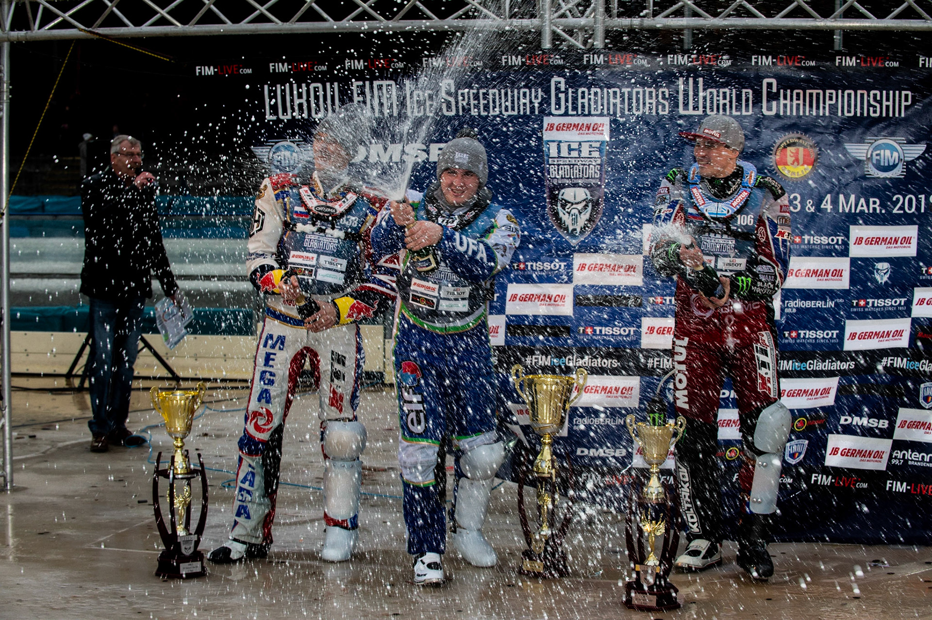 Photo: Ian Charles

Top 3 Sunday: (l-r) Danil Ivanov (333)(2nd), 114\ (Winner) Dmitri Koltakov (106) (3rd) spraying the champagne 

FIM Ice Speedway Gladiators World Championship, Final 3.2, Horst-Dohm Eisstadion, Berlin, Germany Sunday  3  March  2019