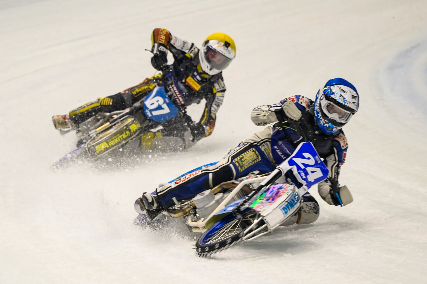 Max Koivula (24) of Finland  in Blue leading Heikki Huusko (67) of Finland  in Yellow during the Ice Speedway Gladiators World Championship Final 1 at Max-Aicher-Arena, Inzell on Saturday 14th March 2026. (Photo: Ian Charles | MI News)