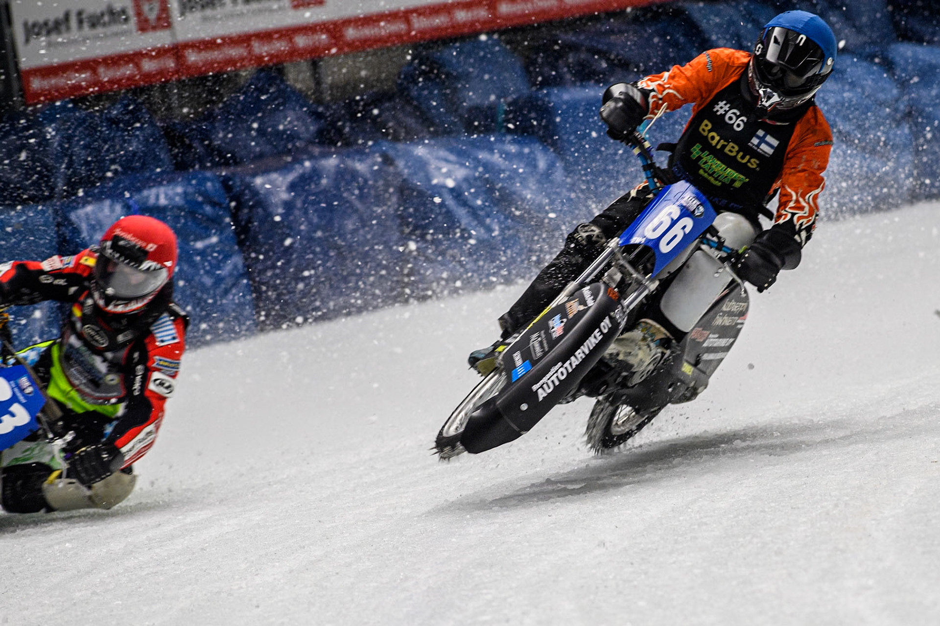 Finland's Aki Ala-Riihimäki (66) (Blue) gets into difficulty as he challenges Germany's Johann Weber (33) (Red) during the FIM Ice Speedway Gladiators World Championship Final 1 at the Max-Aicher-Arena, Inzell on Saturday 23 March 2024. (Photo: Ian Charles | MI News)