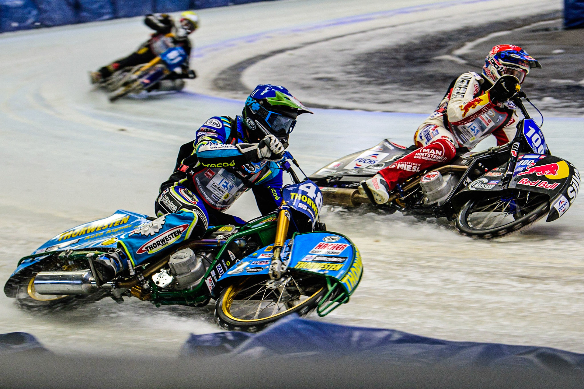 Luca Bauer (48) (Blue) outside Franz Zorn (100) (Red)  during the Ice Speedway Gladiators World Championship Final 2 at Max-Aicher-Arena, Inzell, Germany on Sunday 19th March 2023. (Photo: Ian Charles | MI News)