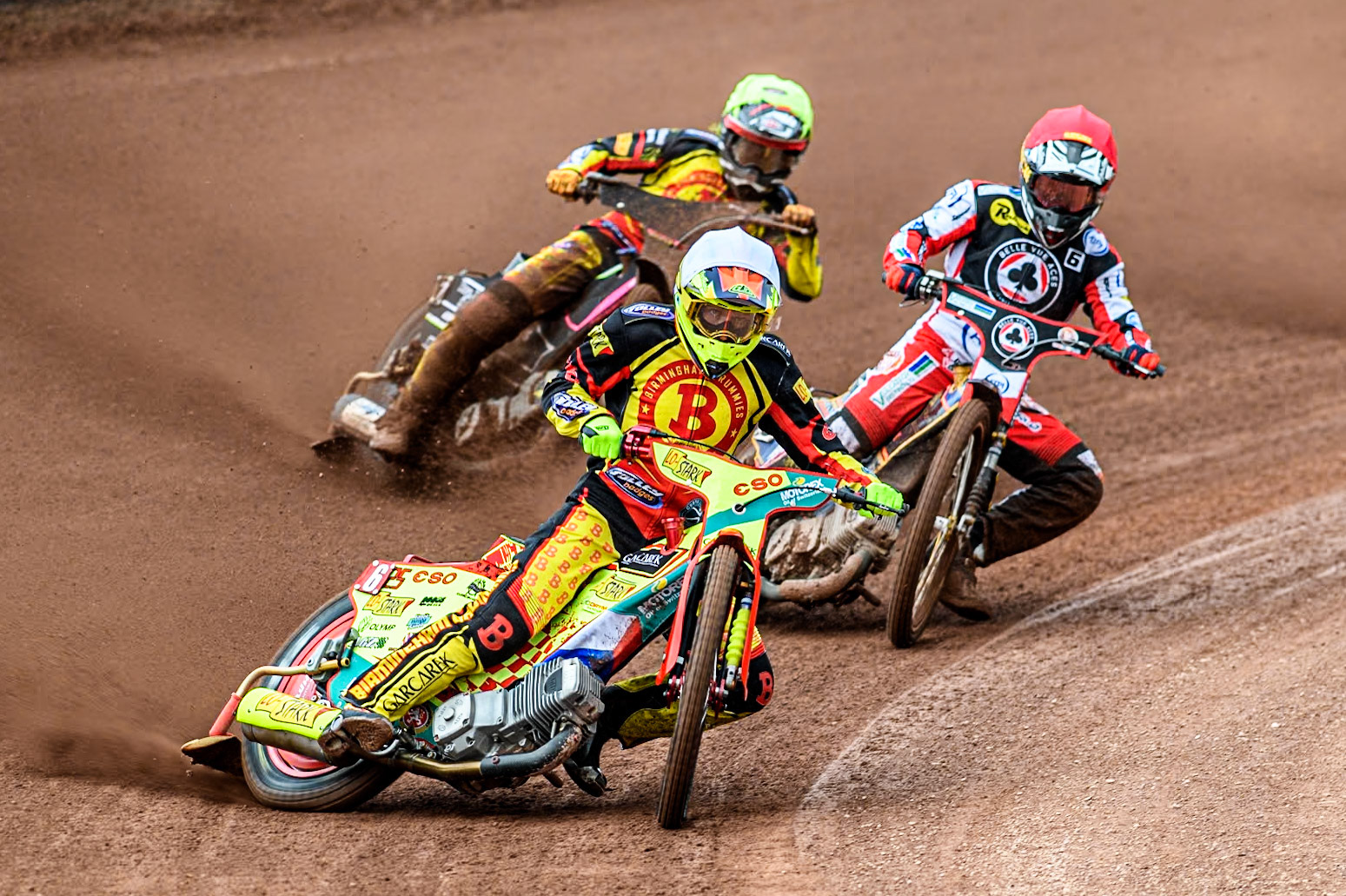 Birmingham Brummies' Vaclav Milik  in White leading Belle Vue Aces' Connor Mountain  in Red and Birmingham Brummies' Leon Flint  in Yellow during the Rowe Motor Oil Premiership match between Belle Vue Aces and Birmingham Brummies at the National Speedway Stadium, Manchester on Monday 6th May 2024. (Photo: Ian Charles | MI News)