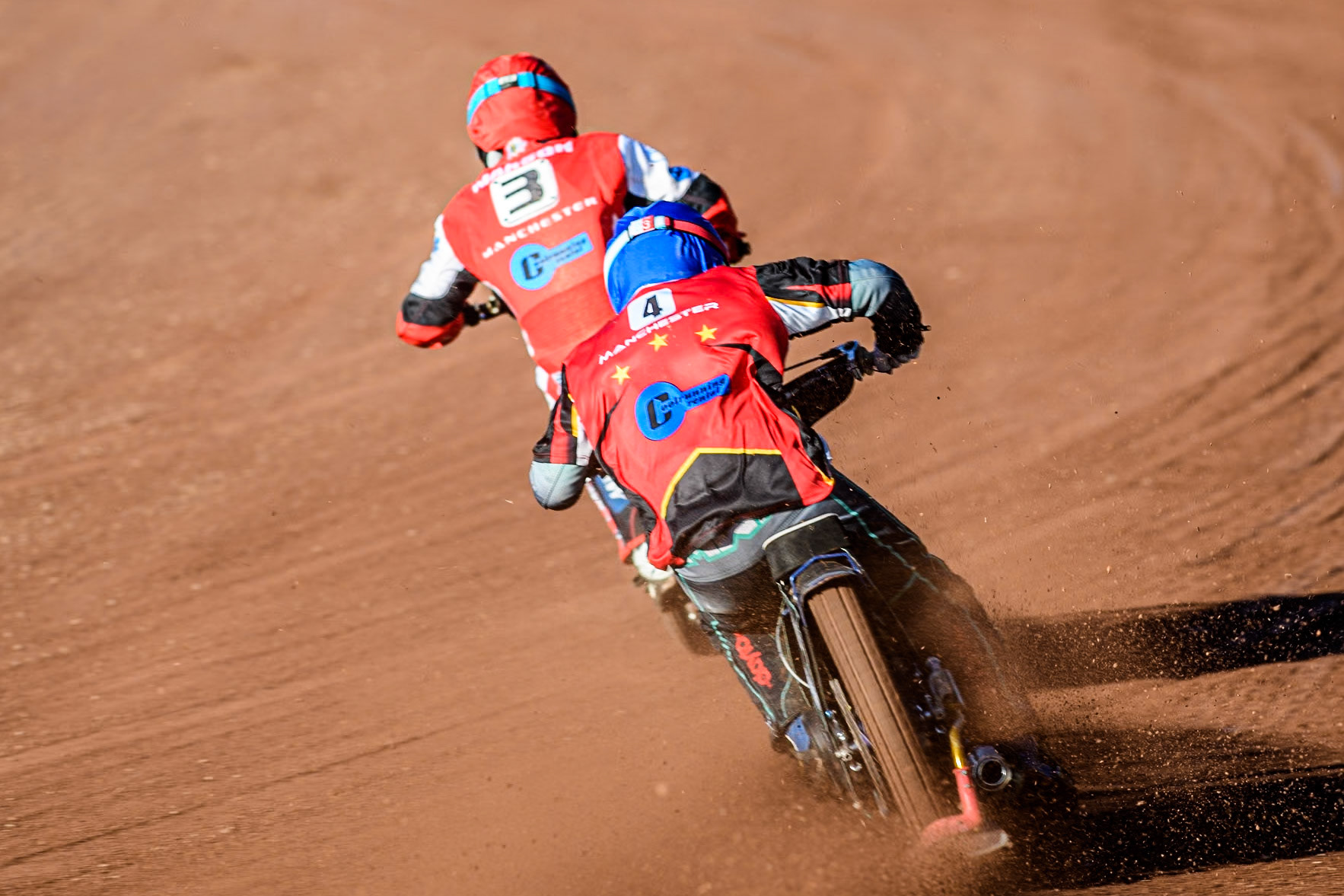 Belle Vue Colts' Guest rider Mason Watson in Blue chases team mate Belle Vue Colts' Matt Marson in Red during the WSRA National Development League match between Belle Vue Colts and Middlesbrough Tigers at the National Speedway Stadium, Manchester on Monday 17th June 2024. (Photo: Ian Charles | MI News)