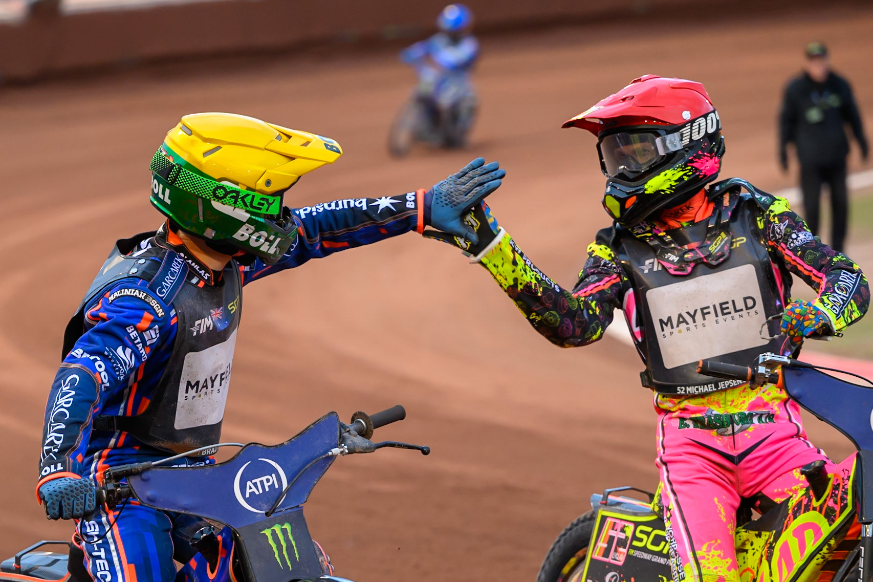 Michael Jepsen Jensen (52) of Denmark in Red congratulates Brady Kurtz (101) of Australia in Yellow during the ATPI  FIM Speedway GP of Manchester at the National Speedway Stadium, Manchester on Saturday 6th June 2026. (Photo: Ian Charles | MI News)