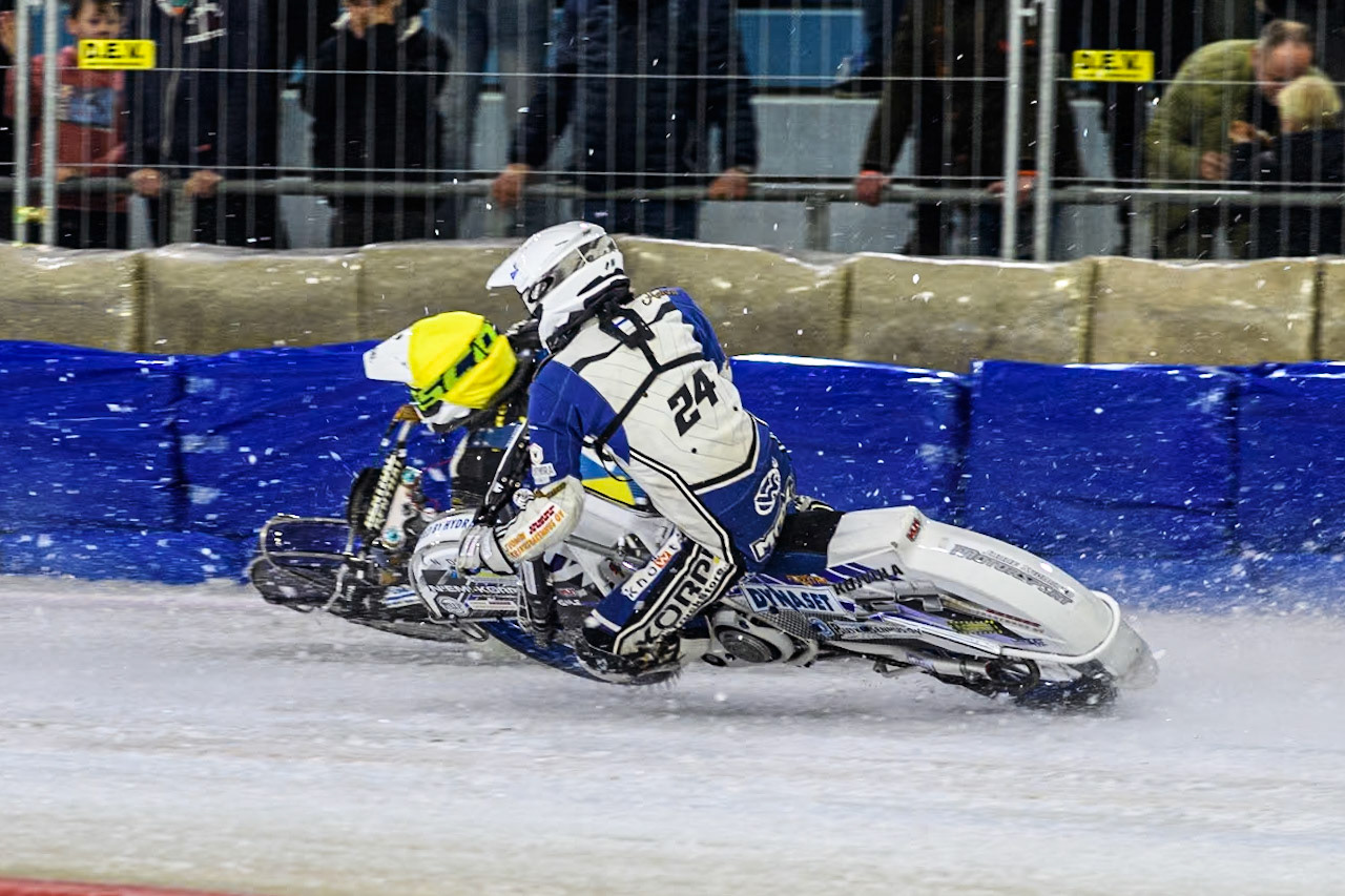 Sweden"s Jimmy Olsén (81) in Yellow passes Finland's Max Koivula (24) in White during the FIM Ice Speedway Gladiators World Championship Final 4 at Ice Rink Thialf, Heerenveen on Sunday 7th April 2024. (Photo: Ian Charles | MI News)