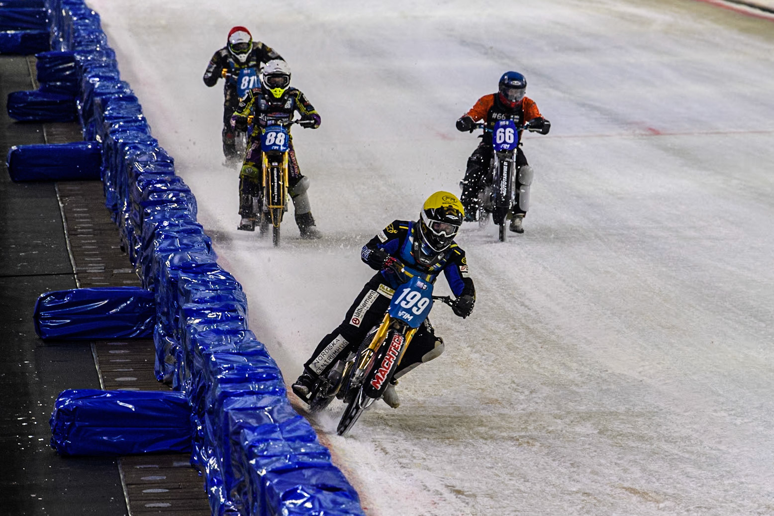 Sweden's Martin Haarahiltunen (199)  in Yellow leading the Final with Germany's Max Niedermaier (88) in White, Finland's Aki Ala-Riihimäki (66) in Blue and Sweden"s Jimmy Olsén (81) in Red behind during the FIM Ice Speedway Gladiators World Championship Final 3 at Ice Rink Thialf, Heerenveen on Saturday 6th April 2024. (Photo: Ian Charles | MI News)