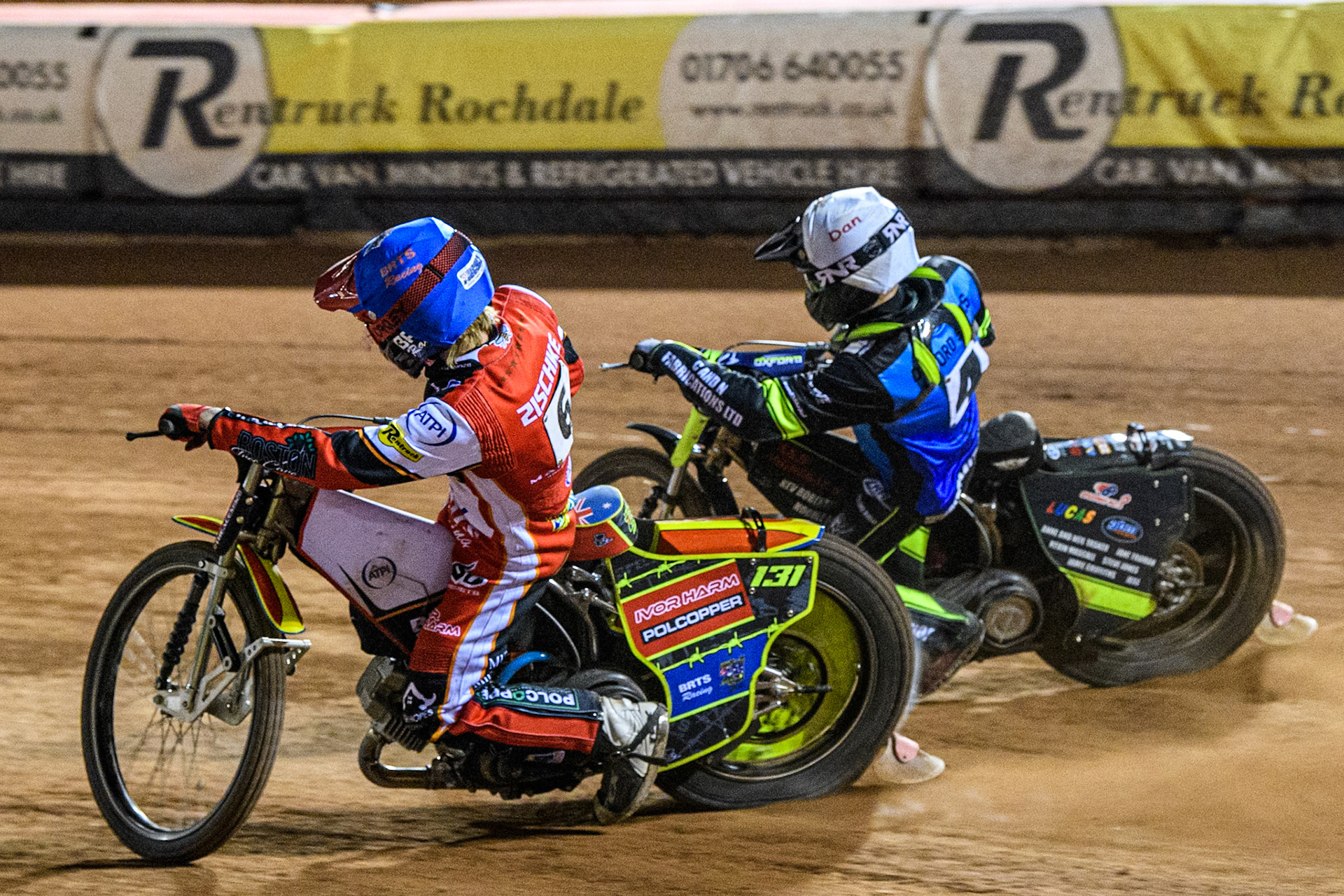 Oxford Spires' Guest Rider Dan Thompson in White rides outside Belle Vue Aces' Tate Zischke in Blue during the Rowe Motor Oil Premiership match between Belle Vue Aces and Oxford Spires at the National Speedway Stadium, Manchester on Monday 14th April 2025. (Photo: Ian Charles | MI News)
