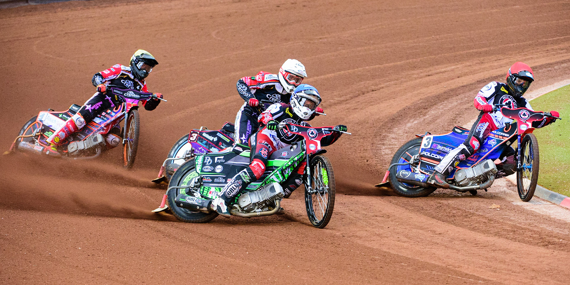 Charles Wright (Blue) outside team mate Brady Kurtz (Red) with Ulrich Oostergaard  (White) and Scott Nicholls  (Yellow) behind during the SGB Premiership match between Belle Vue Aces and Peterborough at the National Speedway Stadium, Manchester on Monday 25th July 2022. (Credit: Ian Charles | MI News