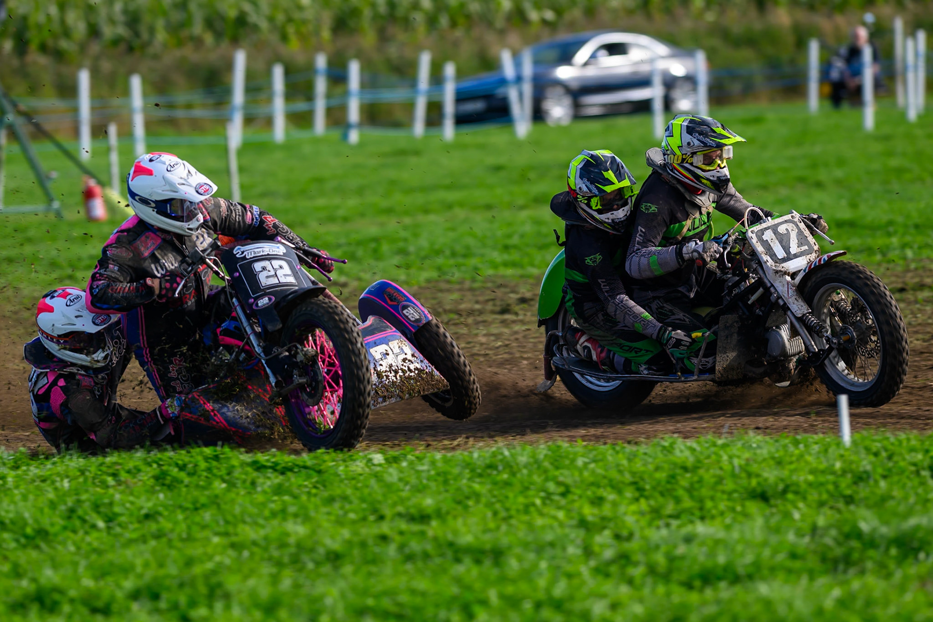 British Masters 1000cc Sidecars: Will Penfold/Ricky Pay (22) on the inside of Neal Owen/Jason Farwell (12) during the British Masters Grasstrack Championship at Lower Marsh Farm, Much Hoole, Preston in Lancashire, England on Sunday 13th September 2026. (Photo: Ian Charles | MI News)
