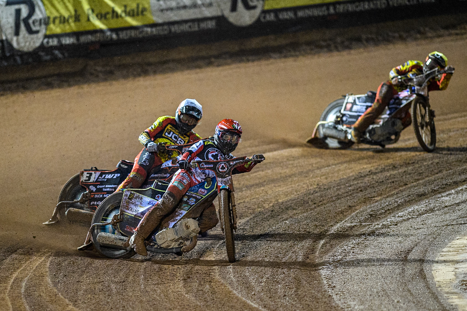 Belle Vue Aces' Jaimon Lidsey  in Red leading Leicester Lions' Sam Masters  in White and Leicester Lions' Luke Becker  in Yellow during the Rowe Motor Oil Premiership Grand Final 1st Leg between Belle Vue Aces and Leicester Lions at the National Speedway Stadium, Manchester on Monday 23rd September 2024. (Photo: Ian Charles | MI News)