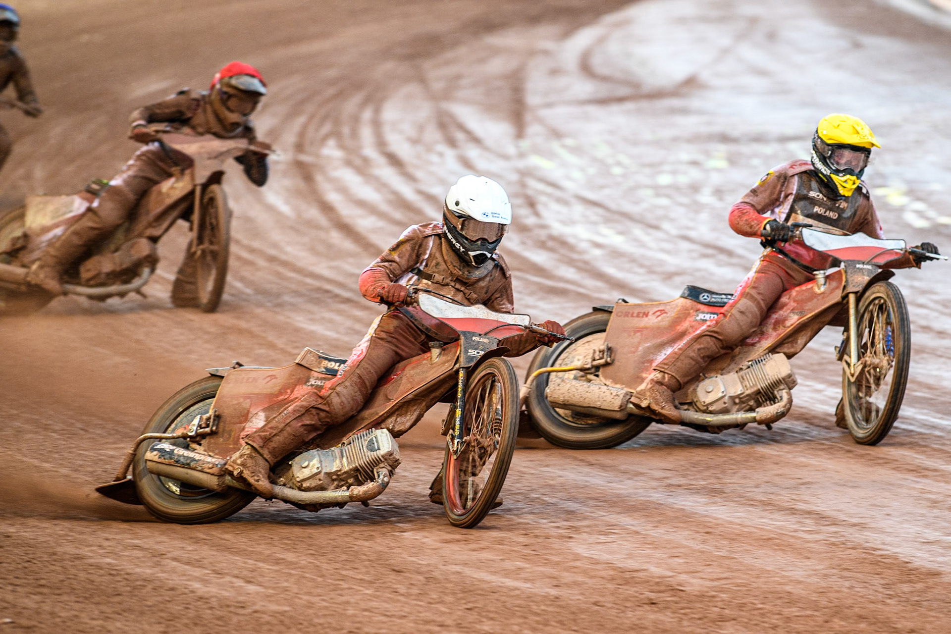 Bartosz Banbor of Poland in White leading Wiktor Przyjemski of Poland in Yellow and Nikita Kaulins of Latvia in Red during the Monster Energy FIM Speedway of Nations 2 (Under 21) Final at the National Speedway Stadium, Manchester on Friday 12th July 2024. (Photo: Ian Charles | MI News)