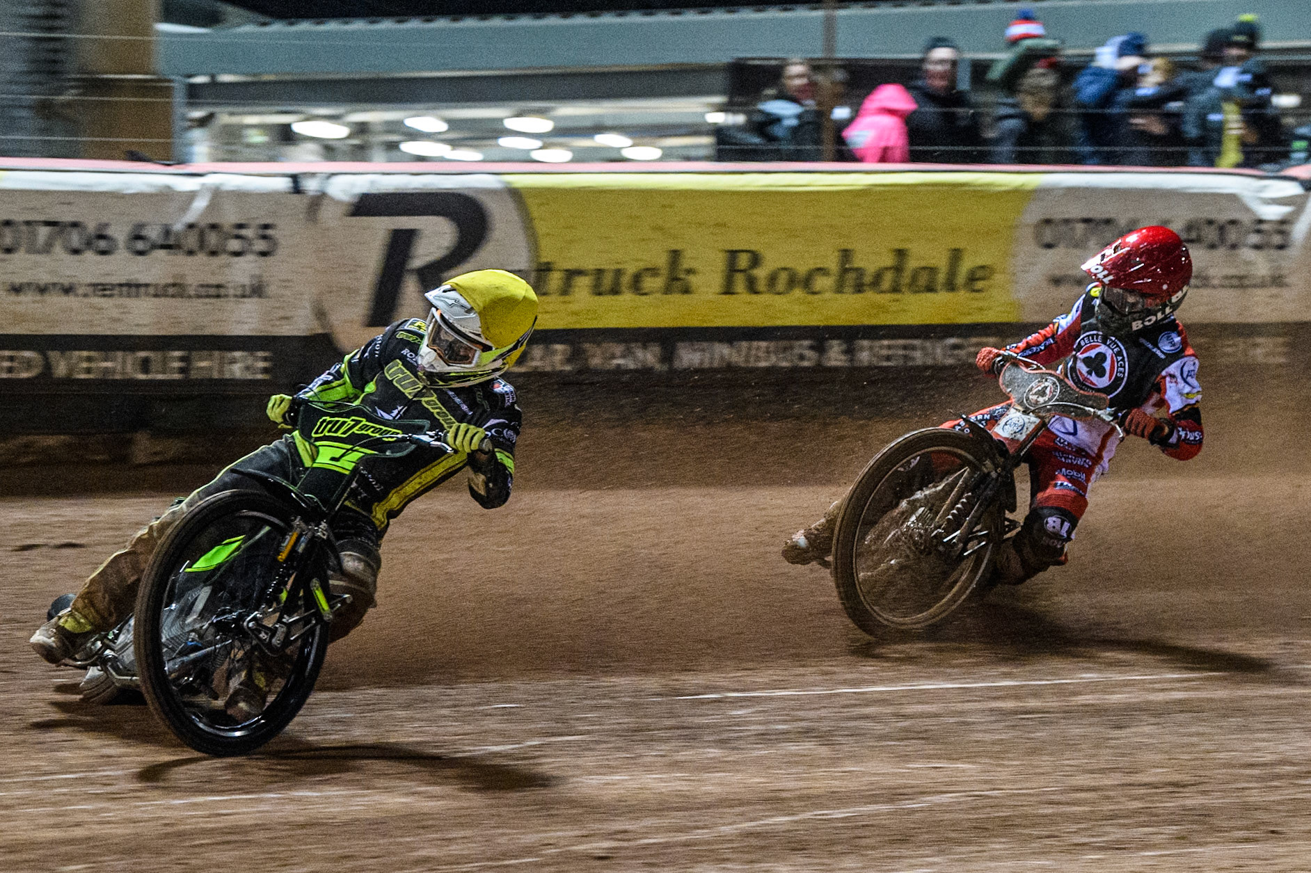 Tom Brennan of Ipswich Witches in Yellow leading Brady Kurtz of Belle Vue Aces in Red during the Premiership Cup Quarter Final 1st Leg match between Belle Vue Aces and Ipswich Witches at the National Speedway Stadium, Manchester on Monday 24th March 2025. (Photo: Ian Charles | MI News)
