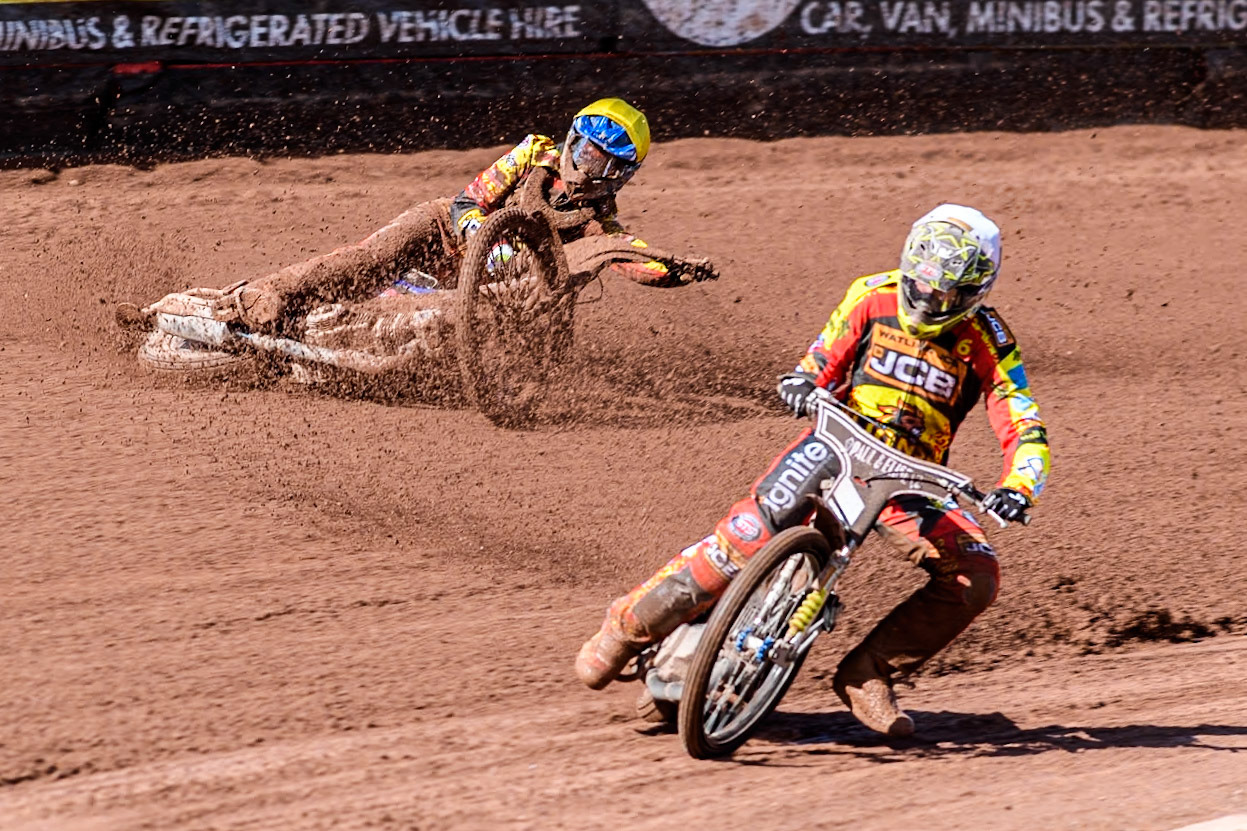 Leicester Lion Cubs' Sonny Springer  (Yellow) falls behind team mate Leicester Lion Cubs' Luke Crang (White) during the WSRA  National Development League match between Belle Vue Colts and Leicester Lion Cubs at the National Speedway Stadium, Manchester on Friday 29th March 2024. (Photo: Ian Charles | MI News)