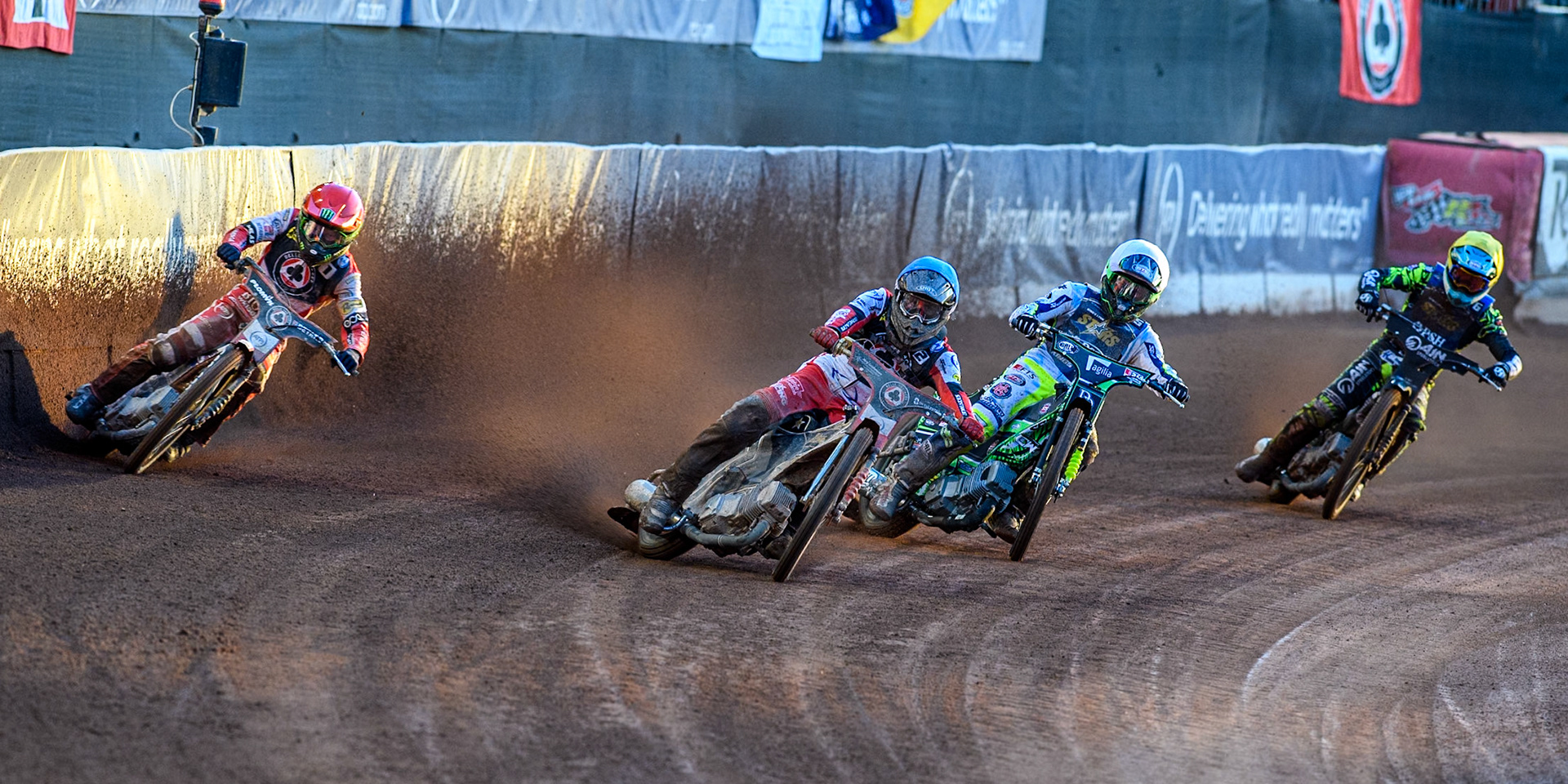 (L to R) Belle Vue Aces' Dan Bewley in Red Belle Vue Aces' Norick Blodorn  in Blue, Kings Lynn Stars' Guest Rider Charles Wright  in White Kings Lynn Stars' Lewis Kerr  in Yellow during the Rowe Motor Oil Premiership match between Belle Vue Aces and King's Lynn Stars at the National Speedway Stadium, Manchester on Monday 12th August 2024. (Photo: Ian Charles | MI News)