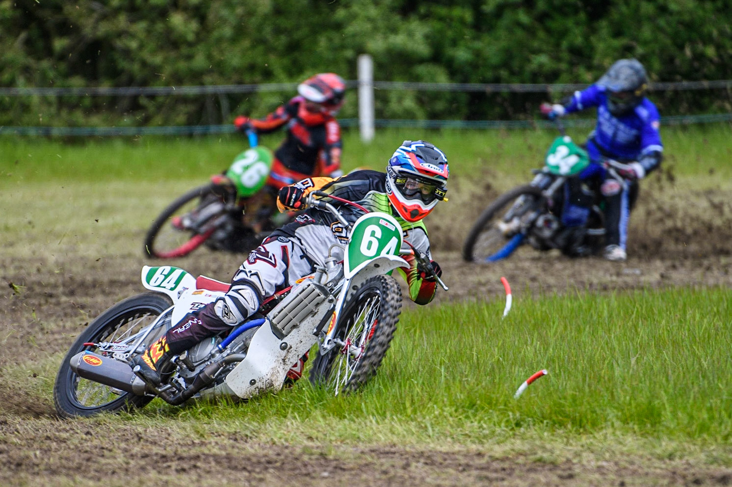 David Knowles (64) has a good lead over Luke Harris (26) and Ben Phillips (34) in the 250cc Class during the Cheshire Grass Track Three Trophies meeting at High Legh, Cheshire on Sunday 14th May 2023. (Photo: Ian Charles | MI News)