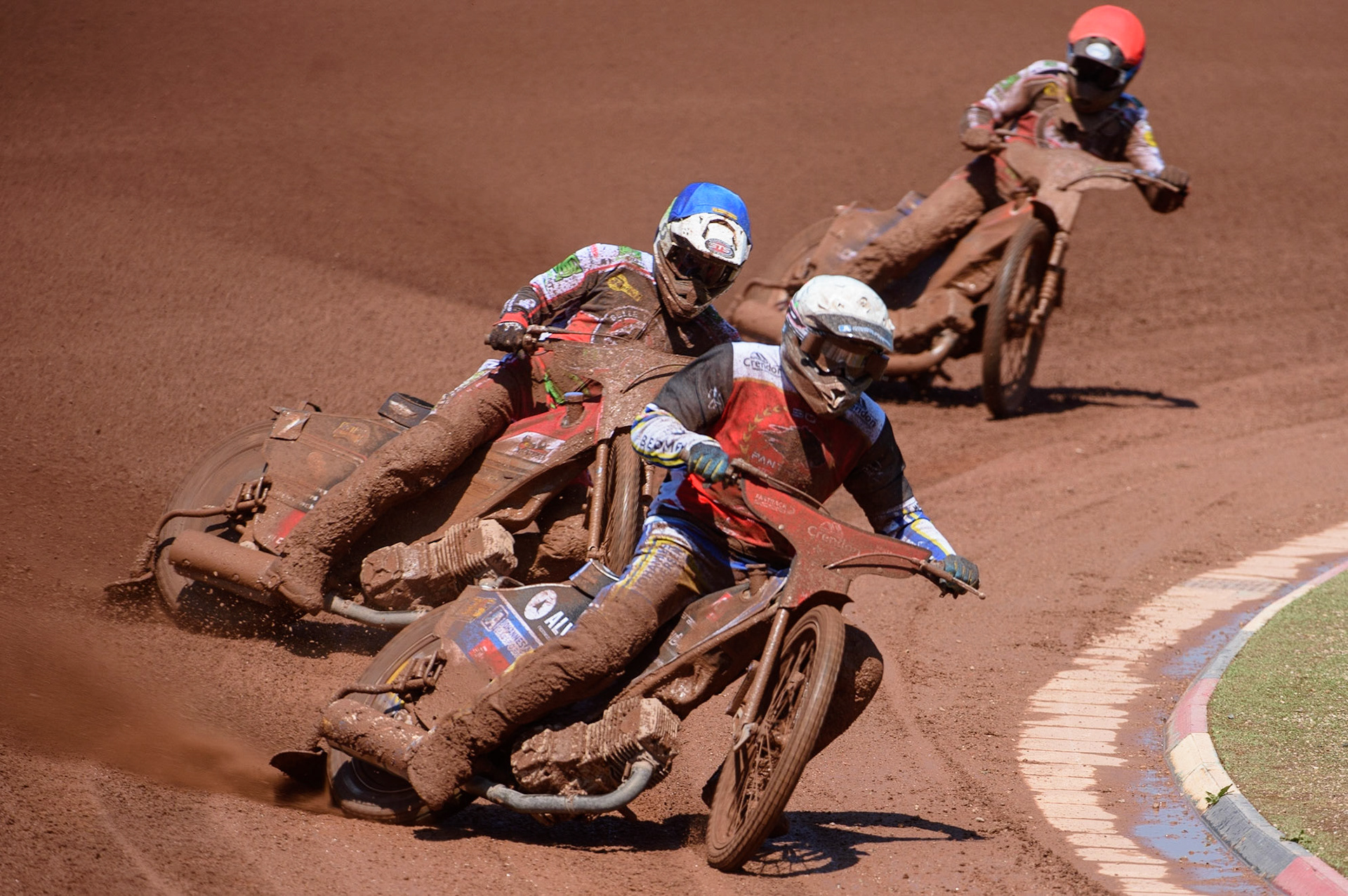 MANCHESTER, UK. MAY 31ST  Bjarne Pedersen  (White) leads Richie Worrall  (Blue) and Brady Kurtz  (Red) during the SGB Premiership match between Belle Vue Aces and Peterborough at the National Speedway Stadium, Manchester on Monday 31st May 2021. (Credit: Ian Charles | MI News)